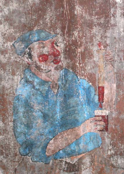 A very old hand painted picture on a cement vat in the Loire Valley