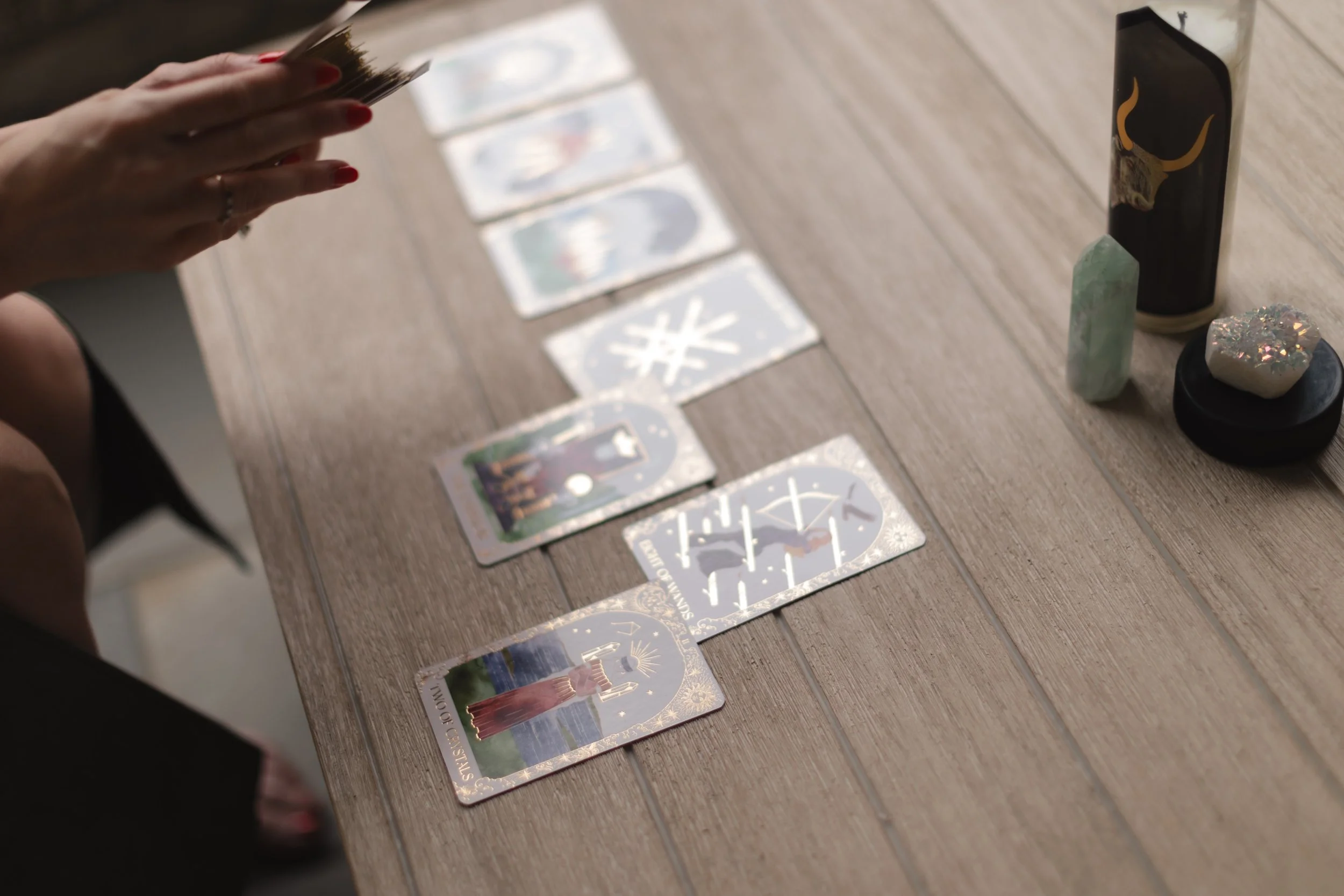 Hands holding chakra crystals