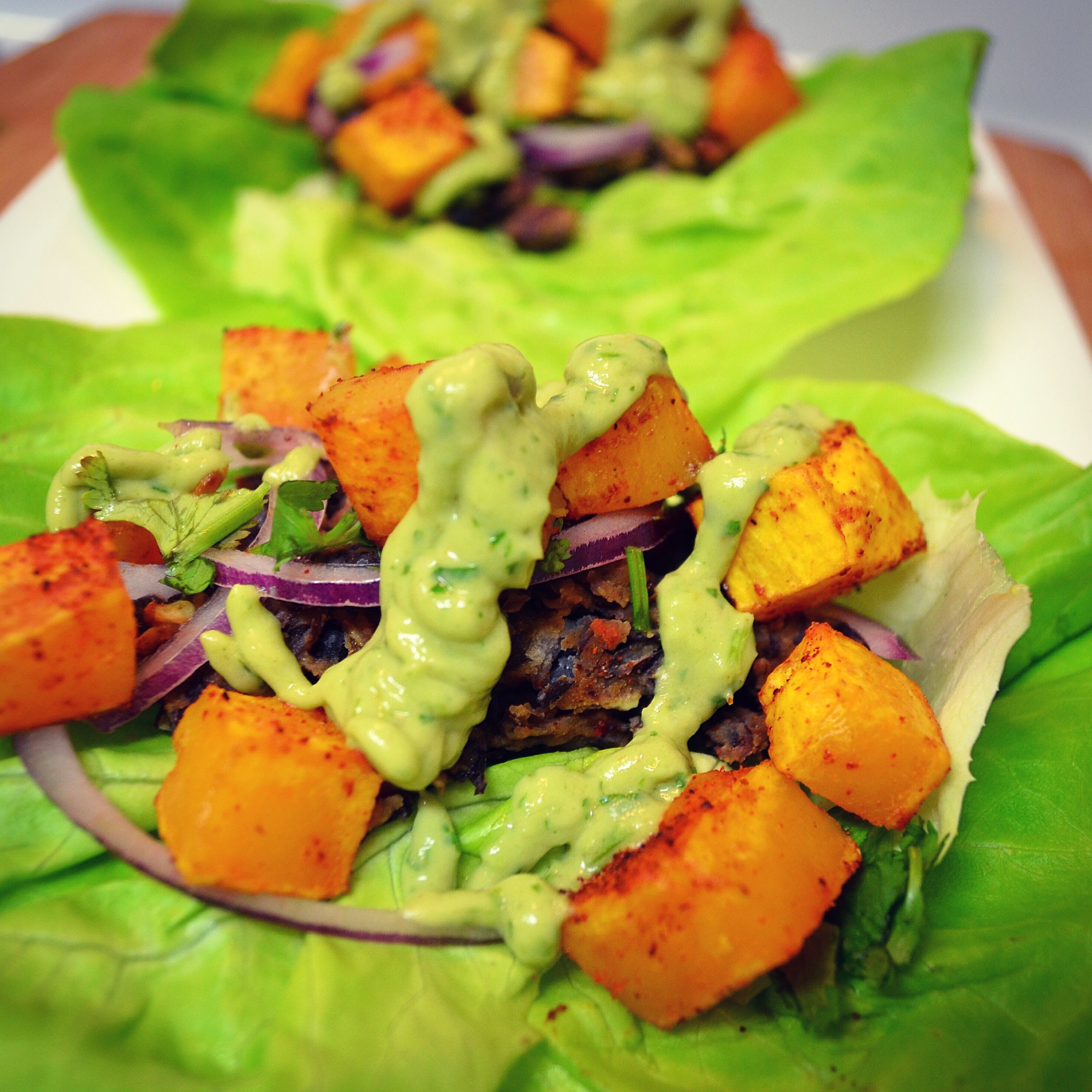 Roasted Butternut Squash & Black Bean Tacos with Avocado, Cilantro & Lime Yogurt Sauce!