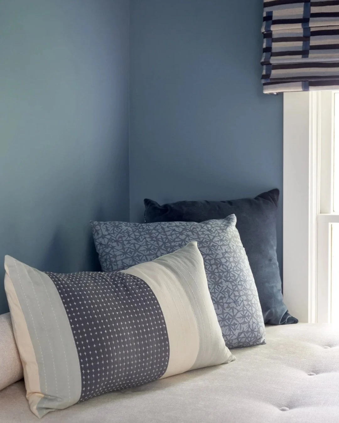 In this 1920s renovation, the challenge was maximizing every single inch of the third floor for high-performance WFH, while carving out a space for rest. 

In His Office, custom millwork was key. A plush daybed cleverly conceals a low-lying HVAC unit