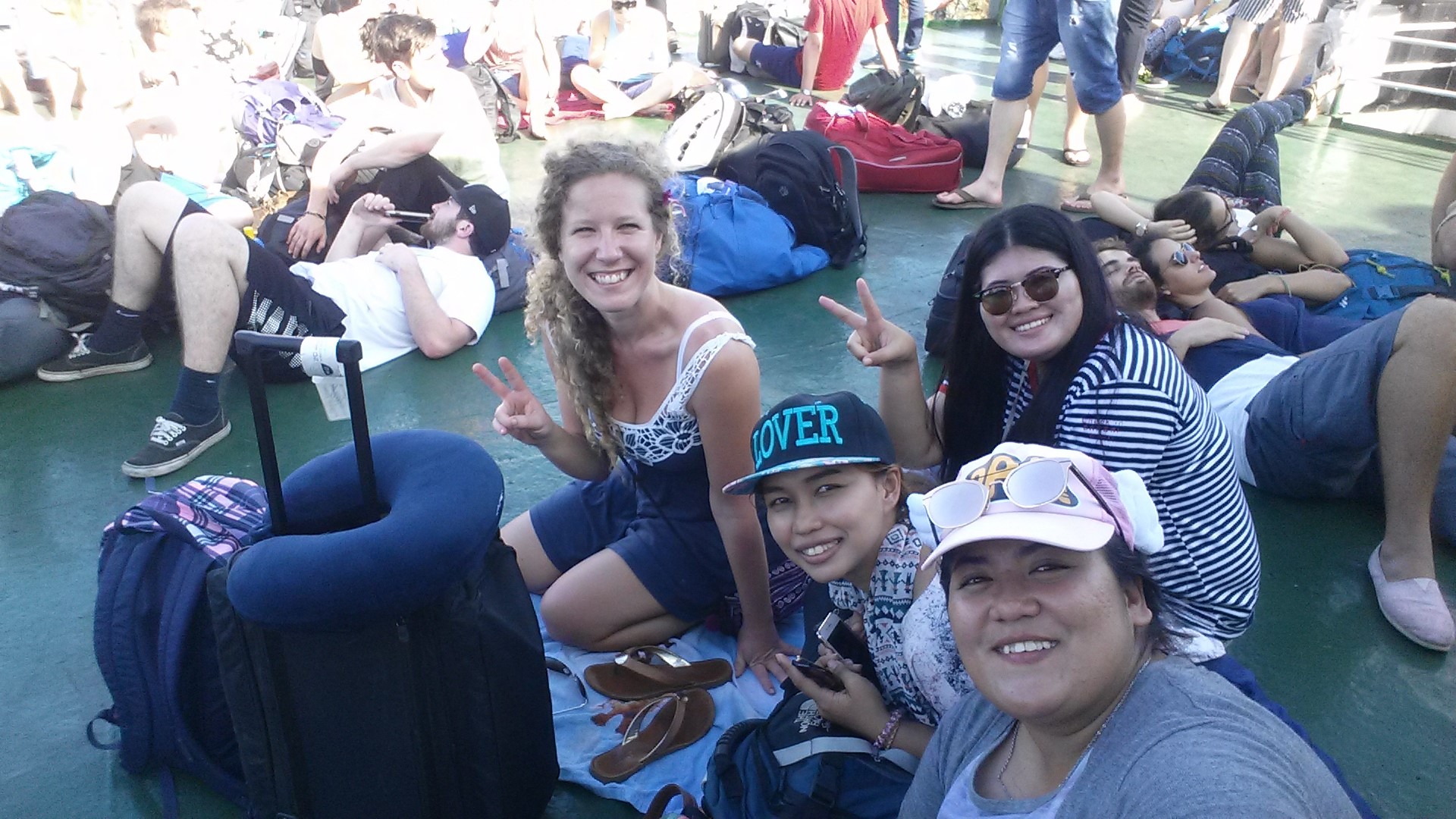 Making new local friends on a Ferry Boat heading to the Island of Koh Pha Ngan, Thailand