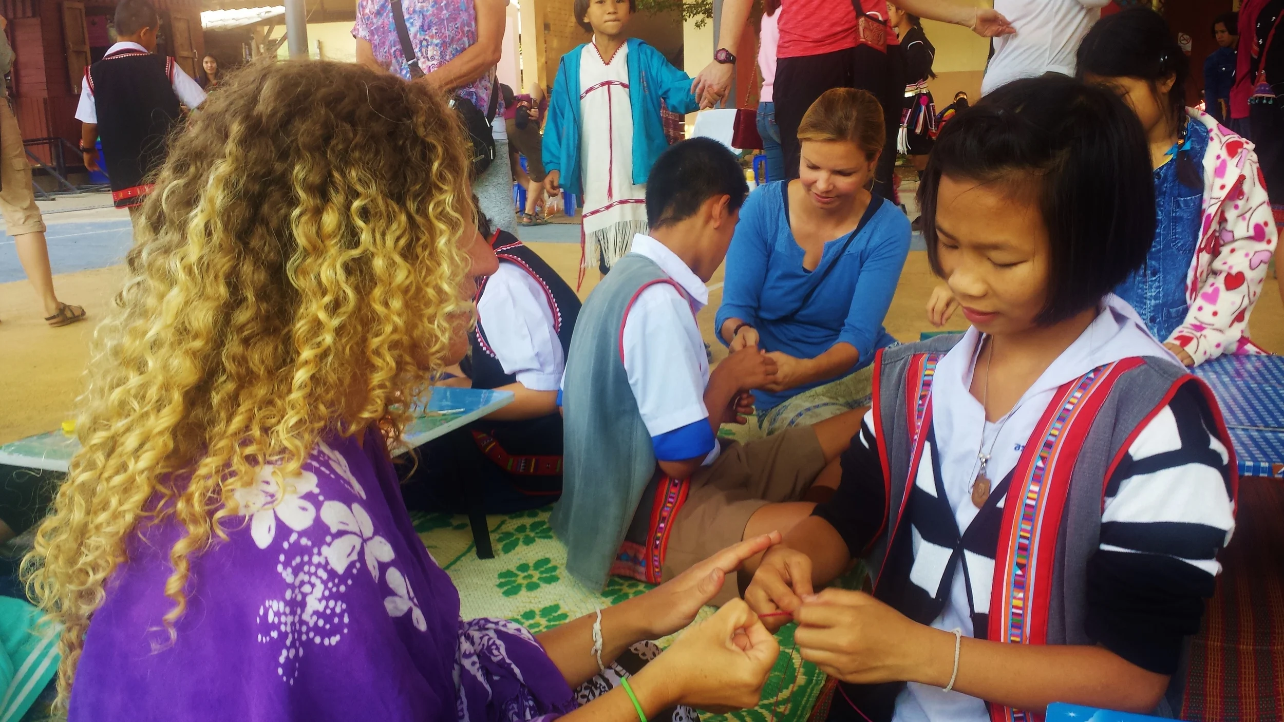 Making bracelets with children from a local Thai school in Chiang Mai