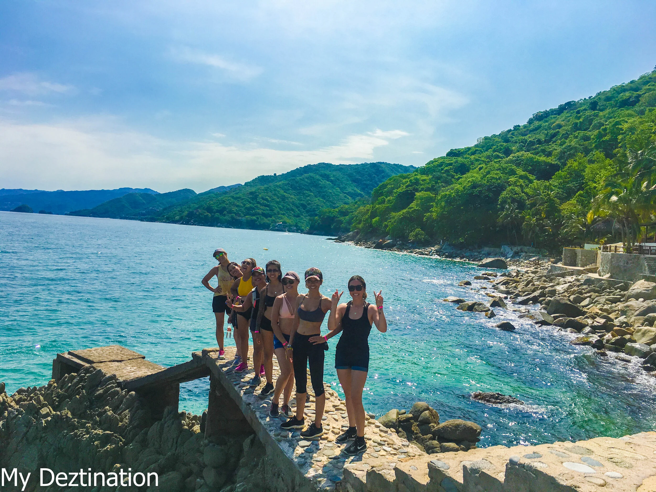 Guests walking down to beach from coastal jungle trail near Puerto Vallarta.