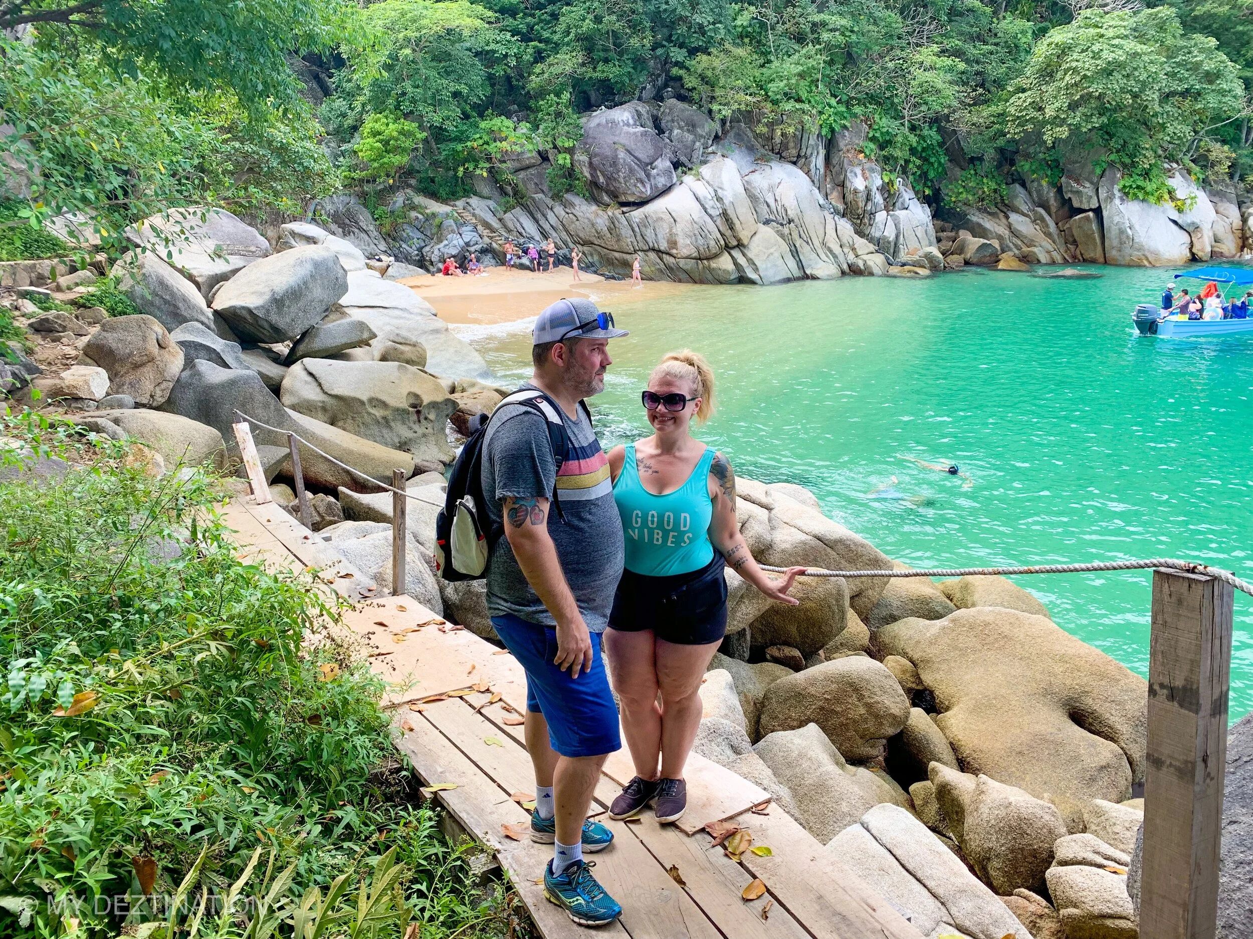 Couple smiling together on Playa Colomitos during My Deztination boutique adventure.