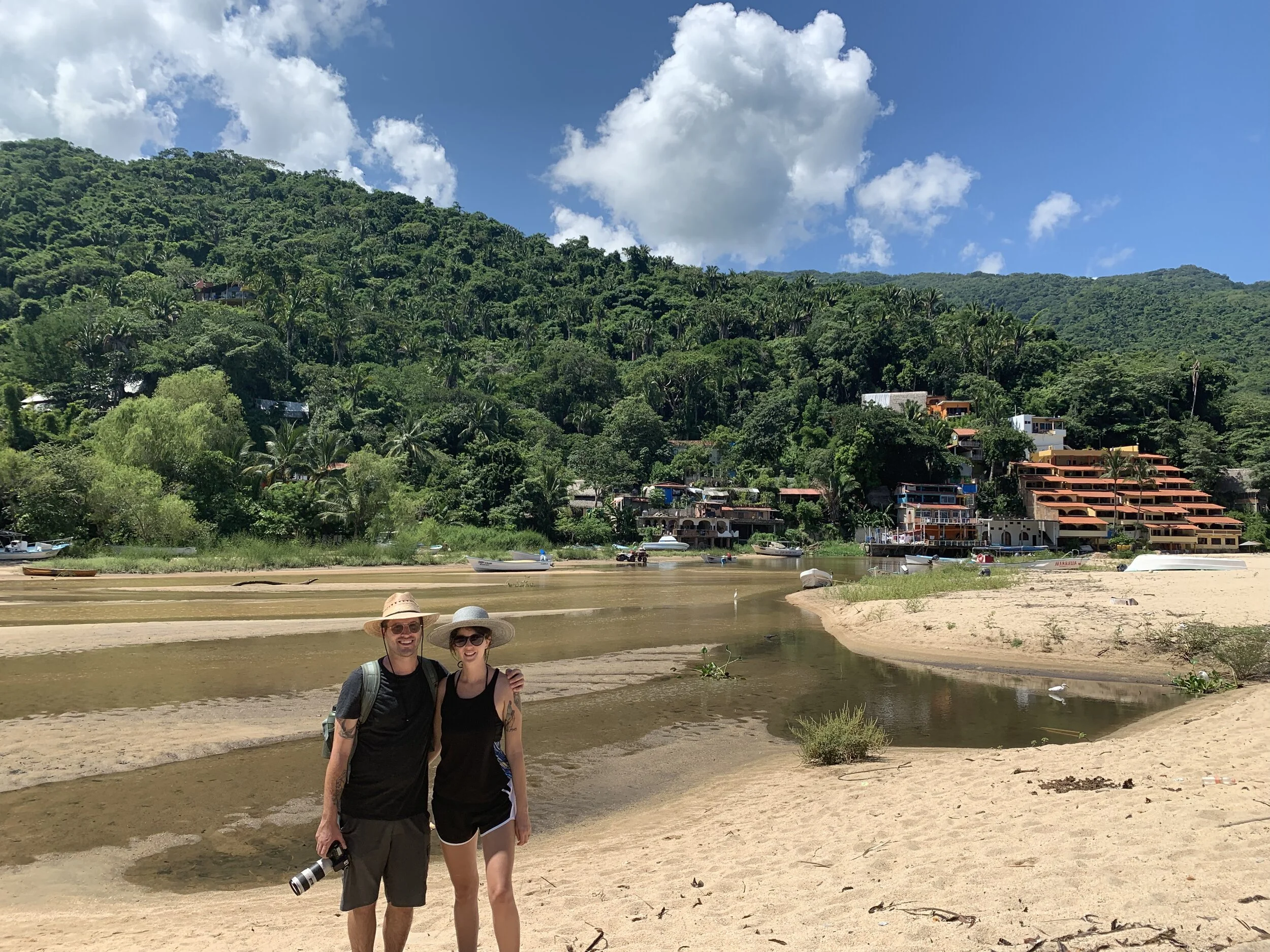 Couple smiling together on sandy Yelapa Beach tour stop.