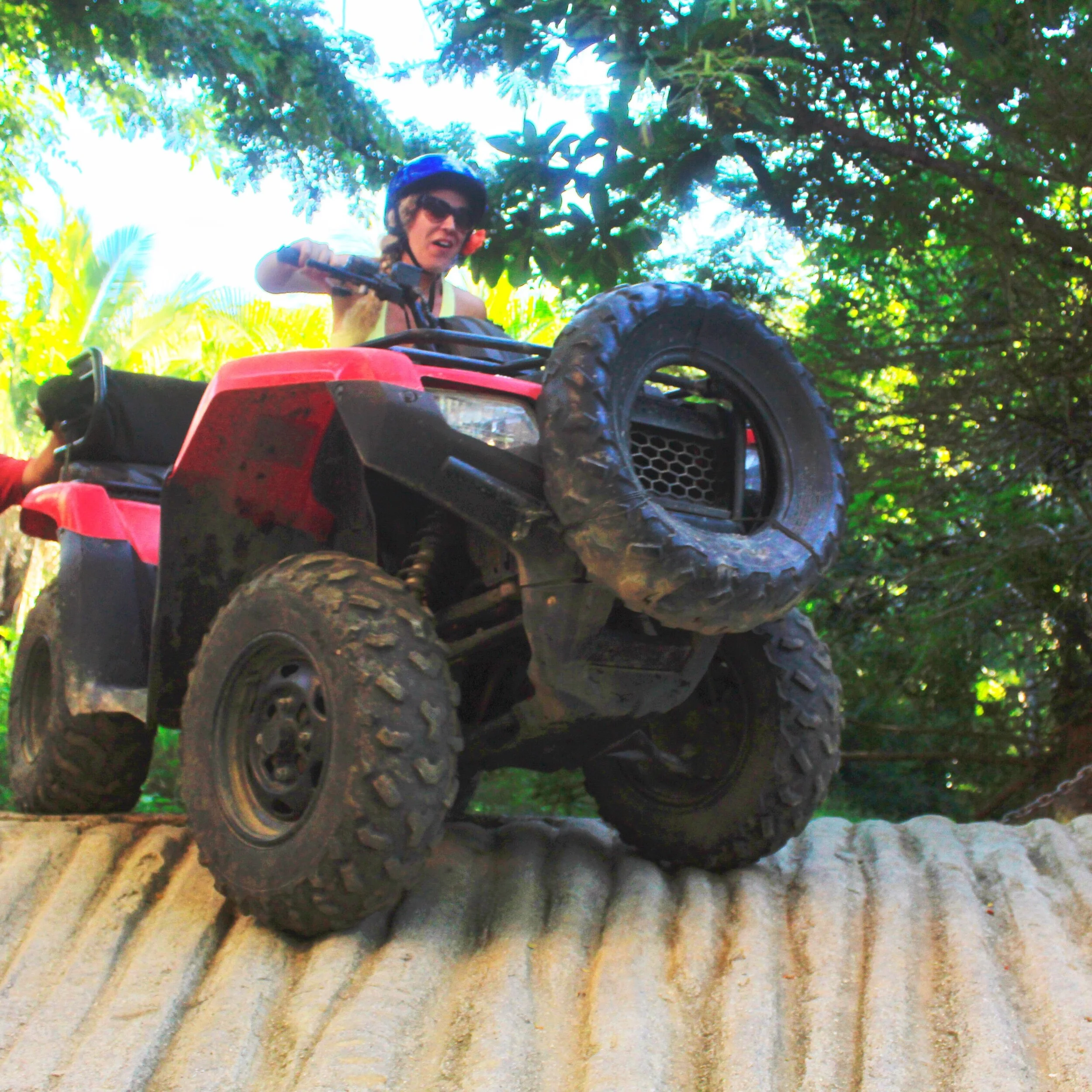 Guest going off-road through jungle on My Deztination ATV tour.