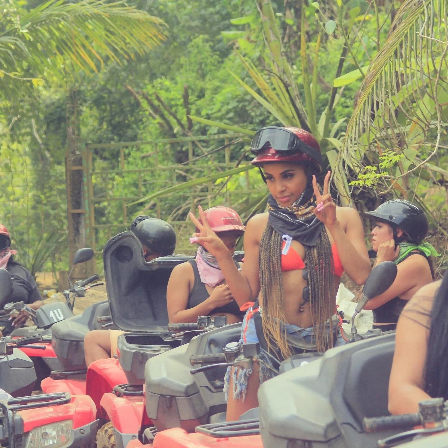 Guest on ATV flashing two peace signs with My Deztination.