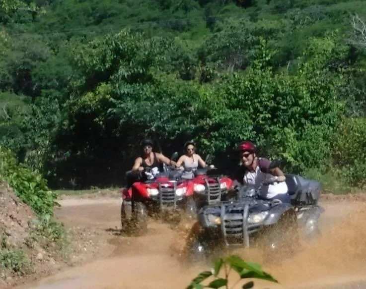 Three ATVs climbing dirt track on My Deztination adventure.