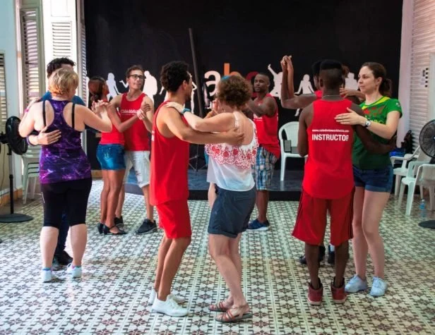 Group of guests learning salsa steps with My Deztination in Puerto Vallarta.
