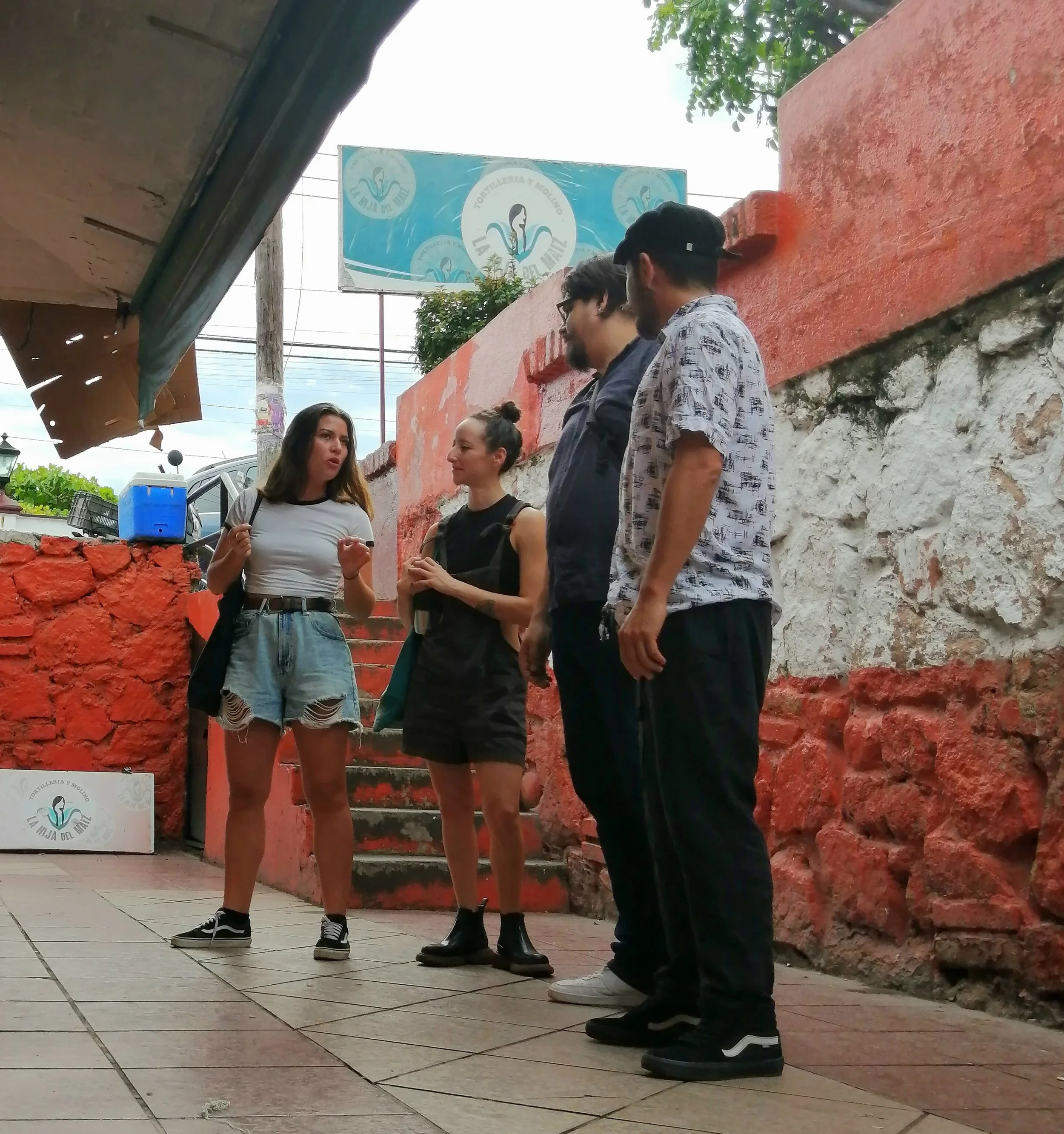 our guide explaining local produce at Puerto Vallarta market with My Deztination.