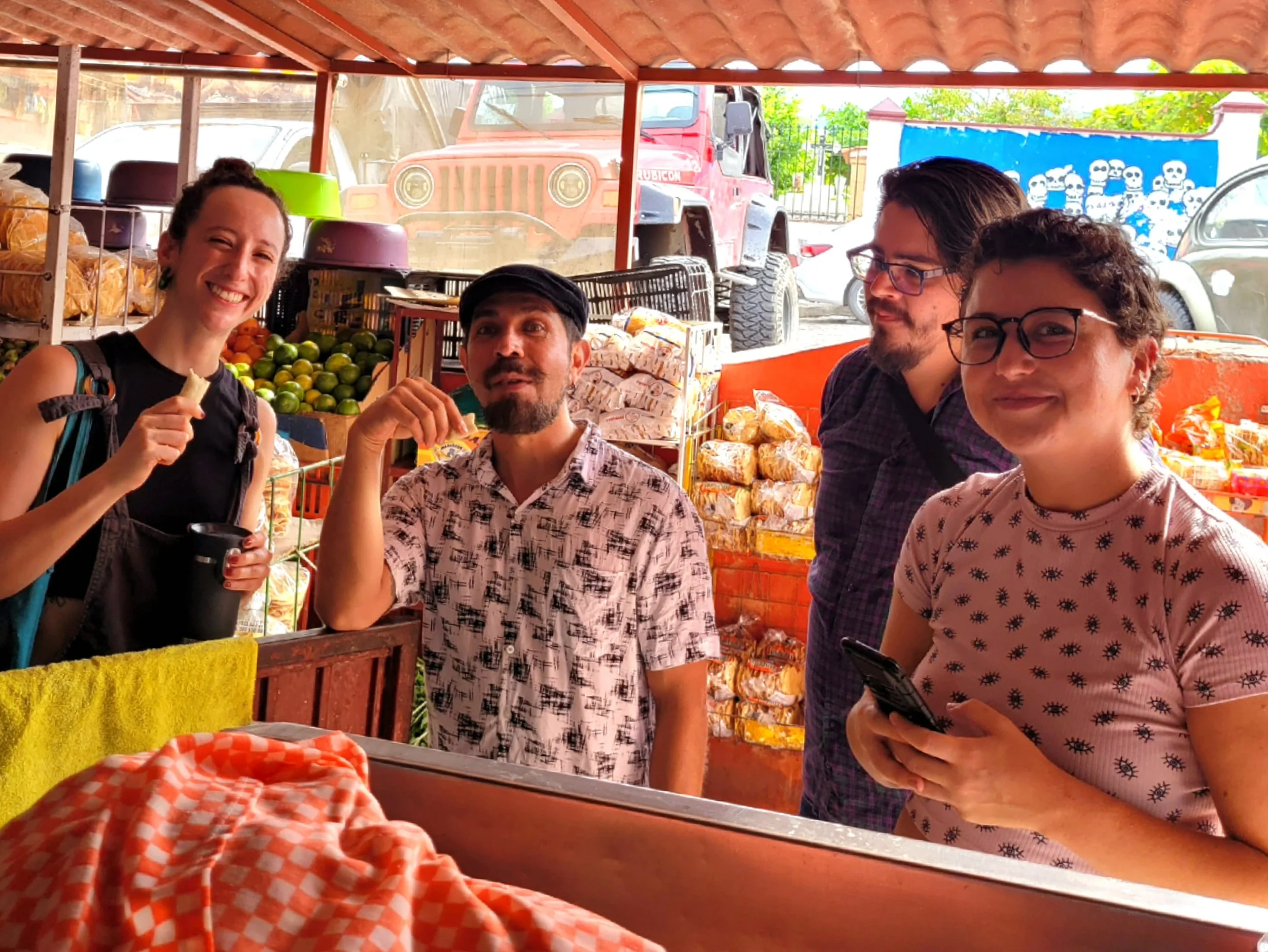 Small group smiling together at Puerto Vallarta market on My Deztination tour.