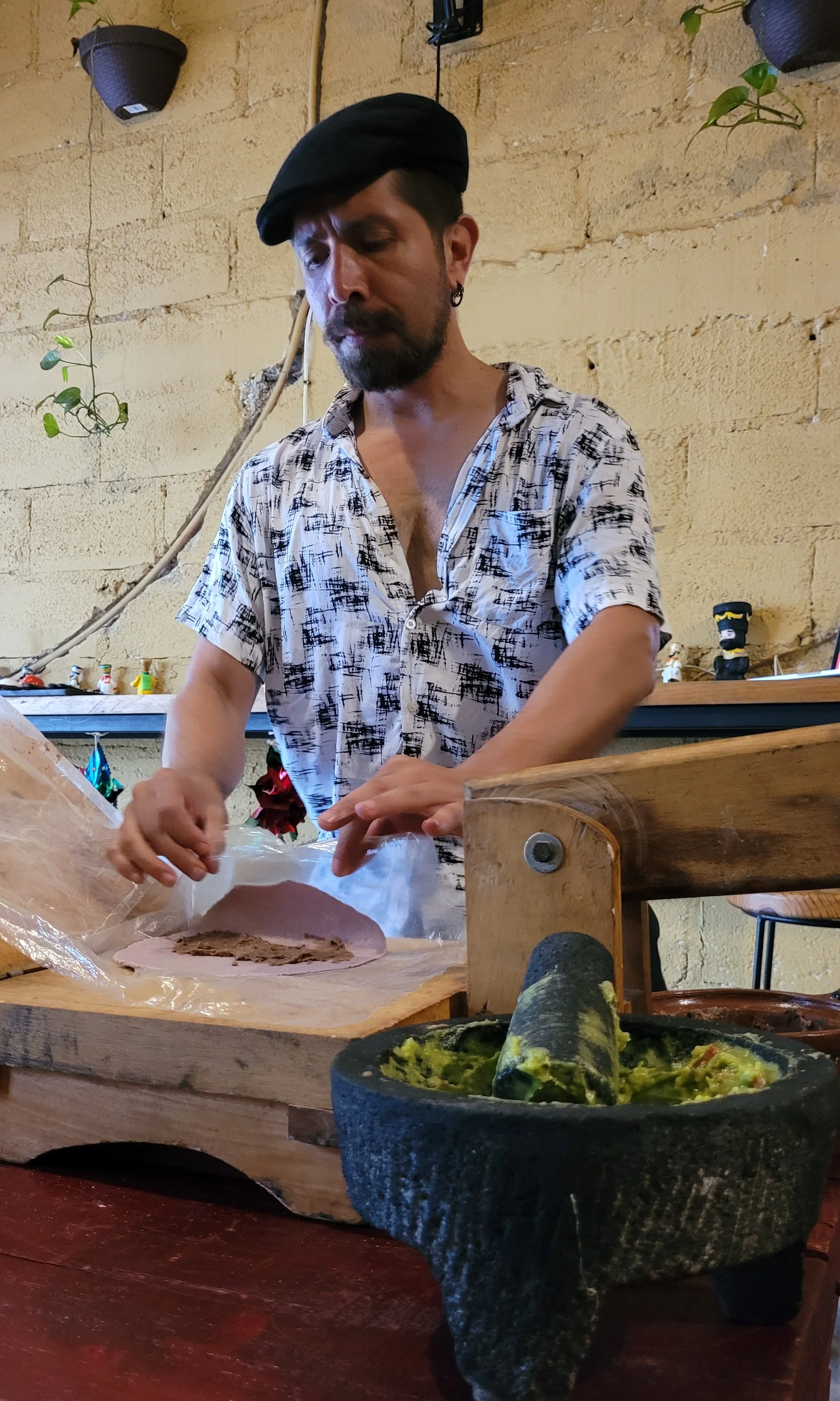 Guest making fresh taco during My Deztination Puerto Vallarta cooking class.