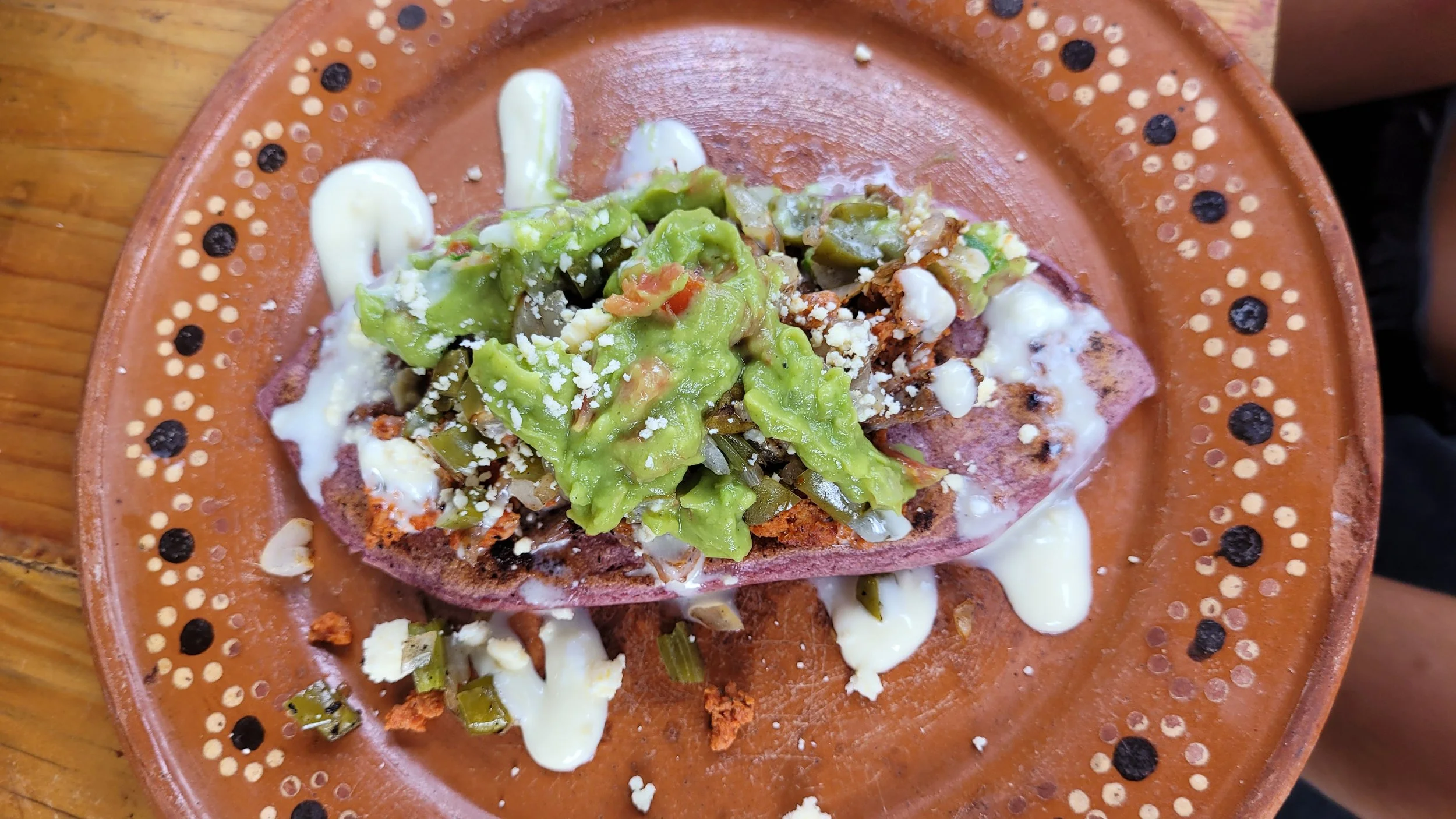 Huarache with salsa and crema served in My Deztination cooking experience.