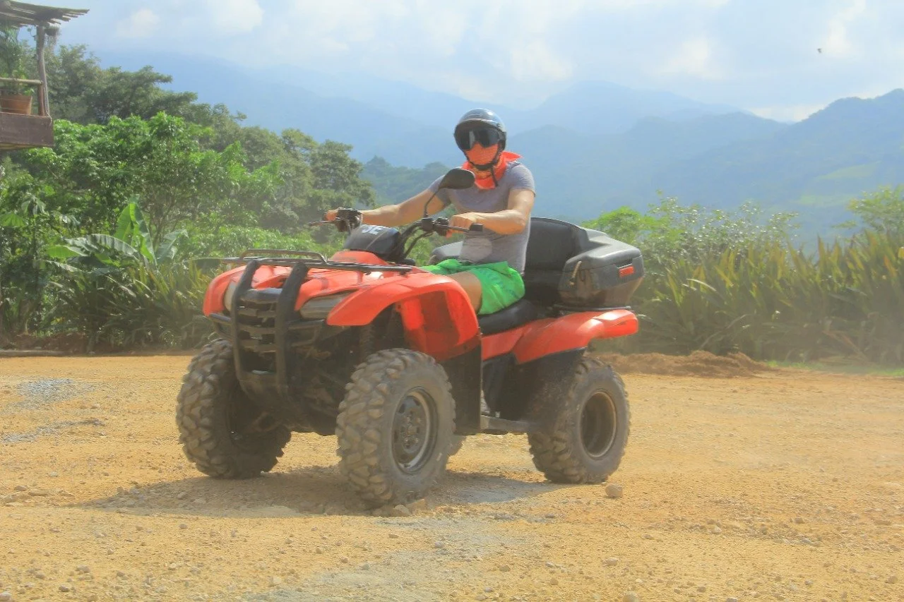 Guest in bandana posing on ATV on My Deztination jungle ride.