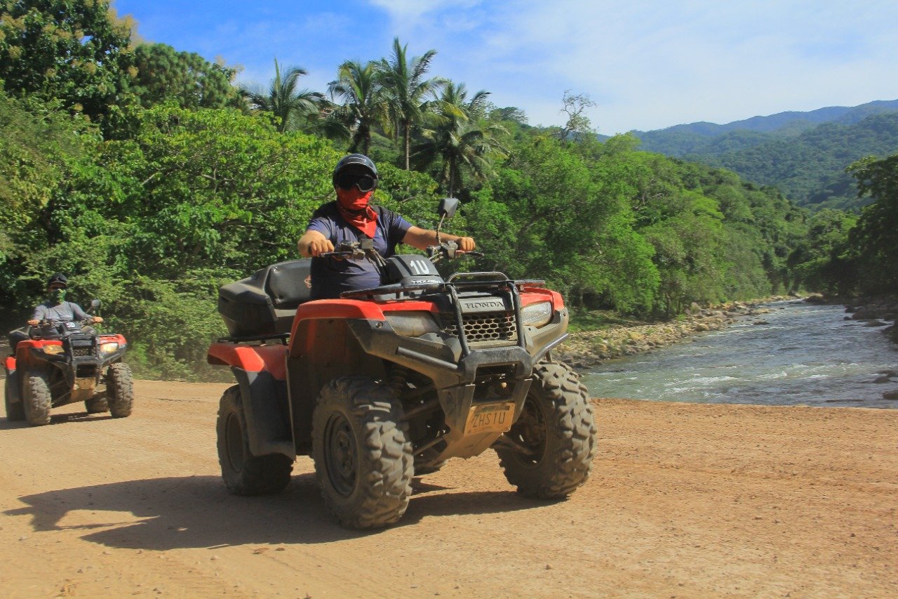 Guest crossing bridge on ATV with My Deztination adventure tour.