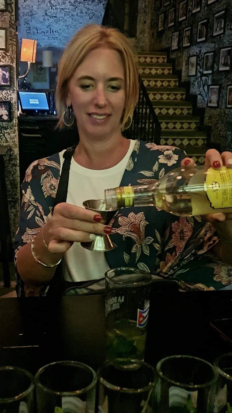 Guest making mojito during My Deztination salsa and cocktail class.