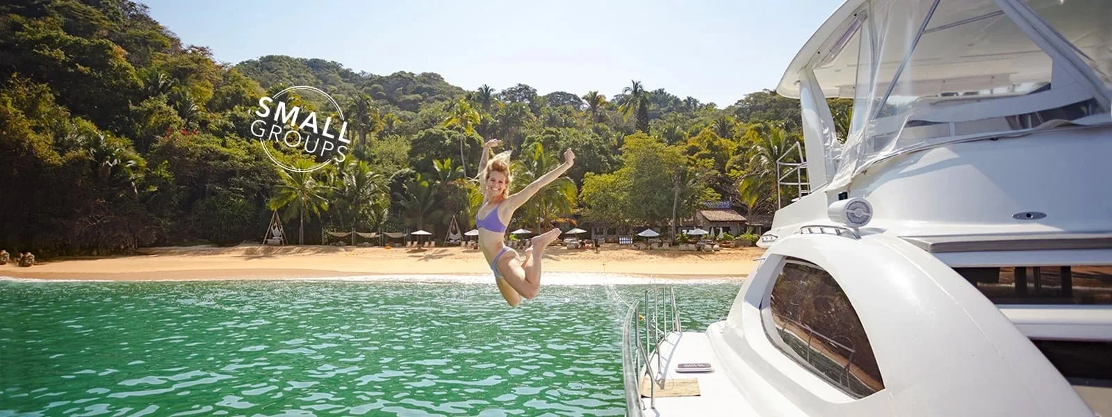 Guest leaping off yacht into turquoise water at Mahahuitas with My Deztination.