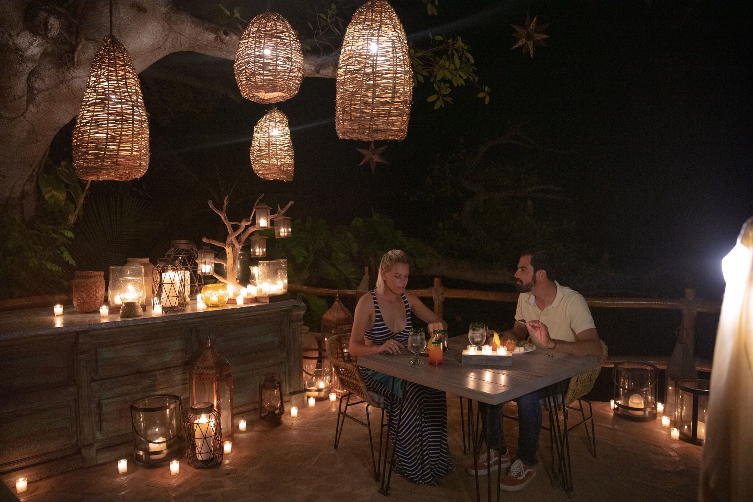Couple enjoying candlelit dinner at Rhythms of the Night with My Deztination.