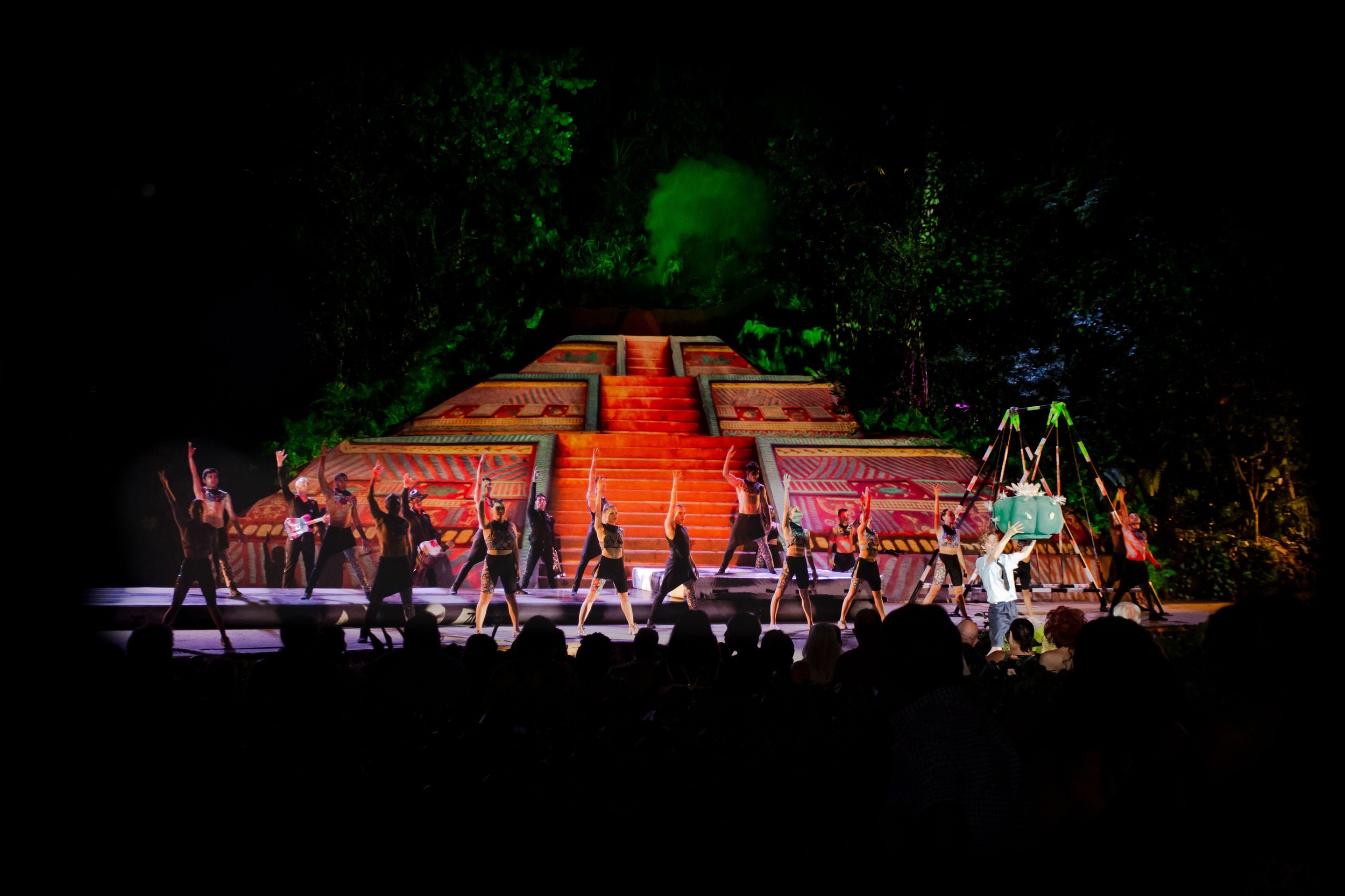 Stage performers in front of Aztec pyramid set at Rhythms of the Night, My Deztination.