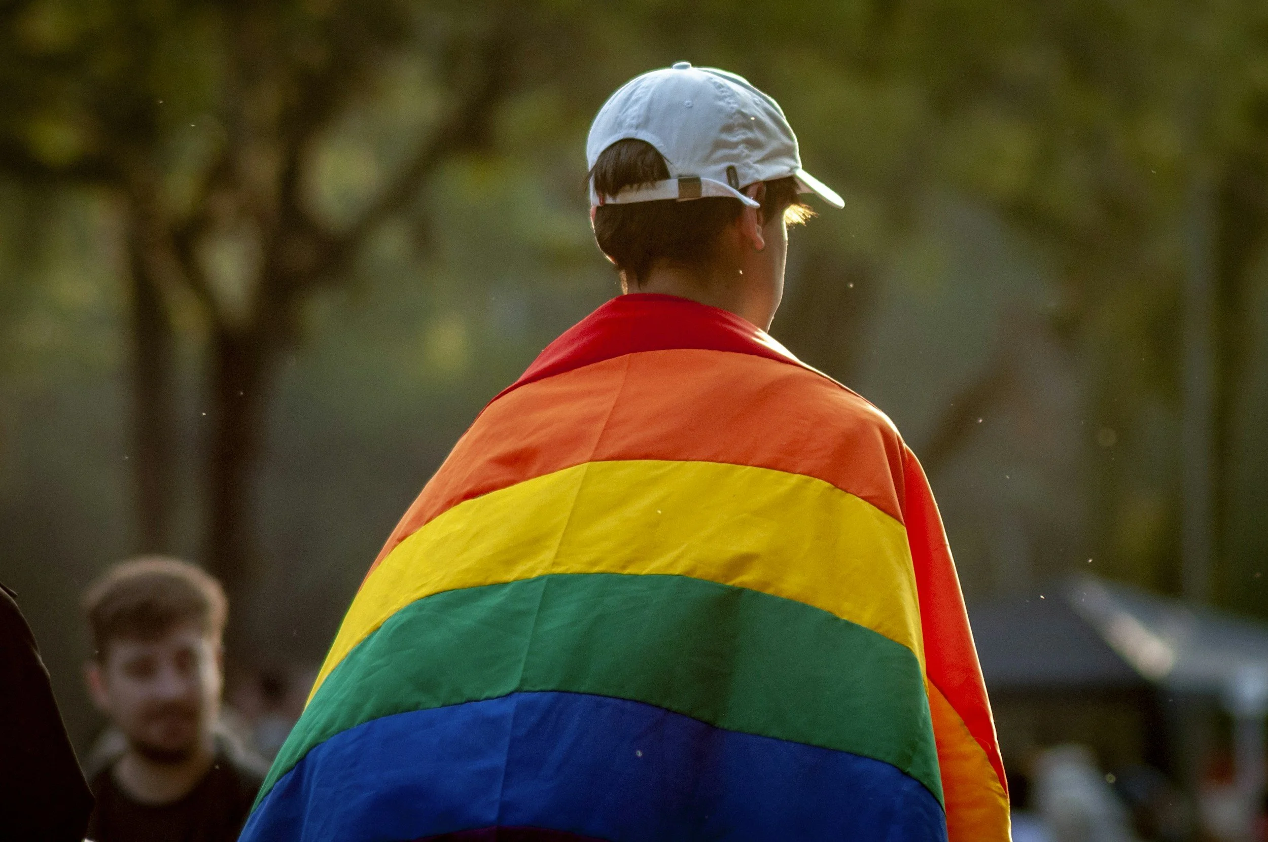 LGBTQ+ My Deztination client wearing a pride flag around their shoulders feeling supported in their new life in Mexico