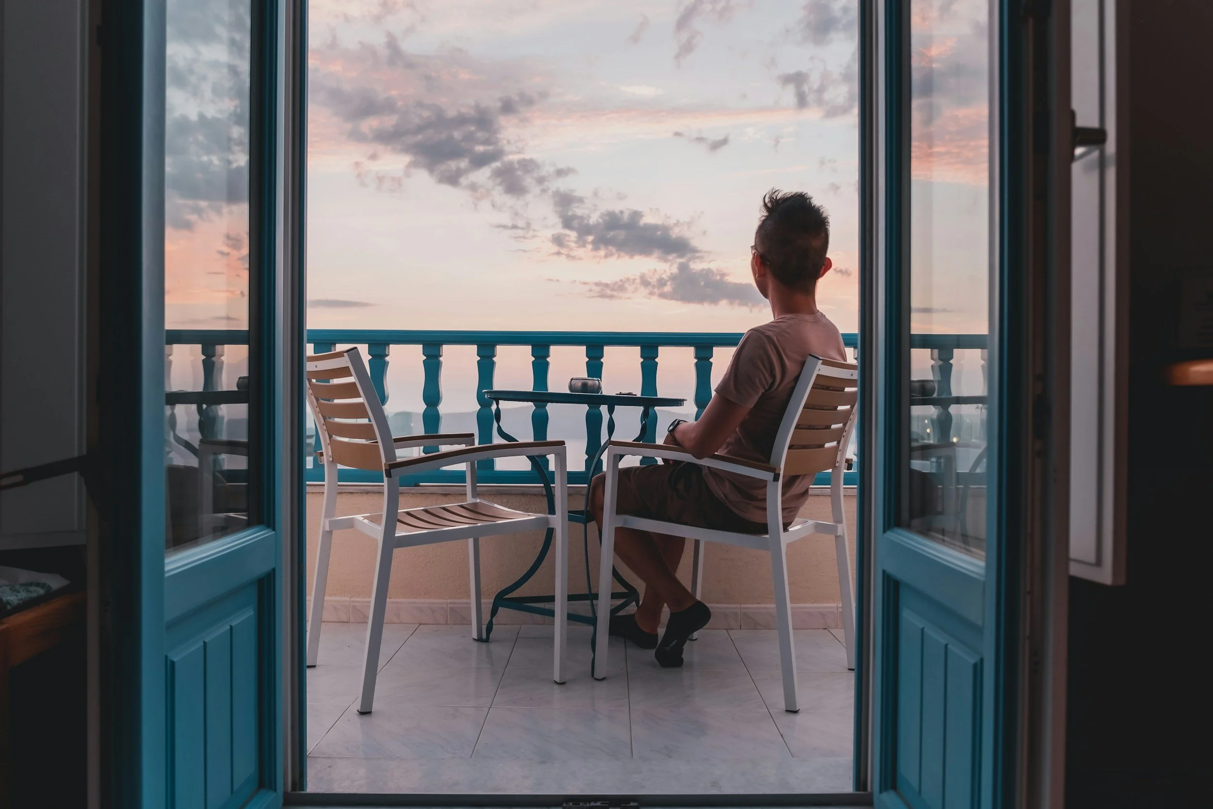 My Deztination client sat on a balcony looking out over the ocean ¨I look out my sliding doors at the ocean every day and say THANK YOU."