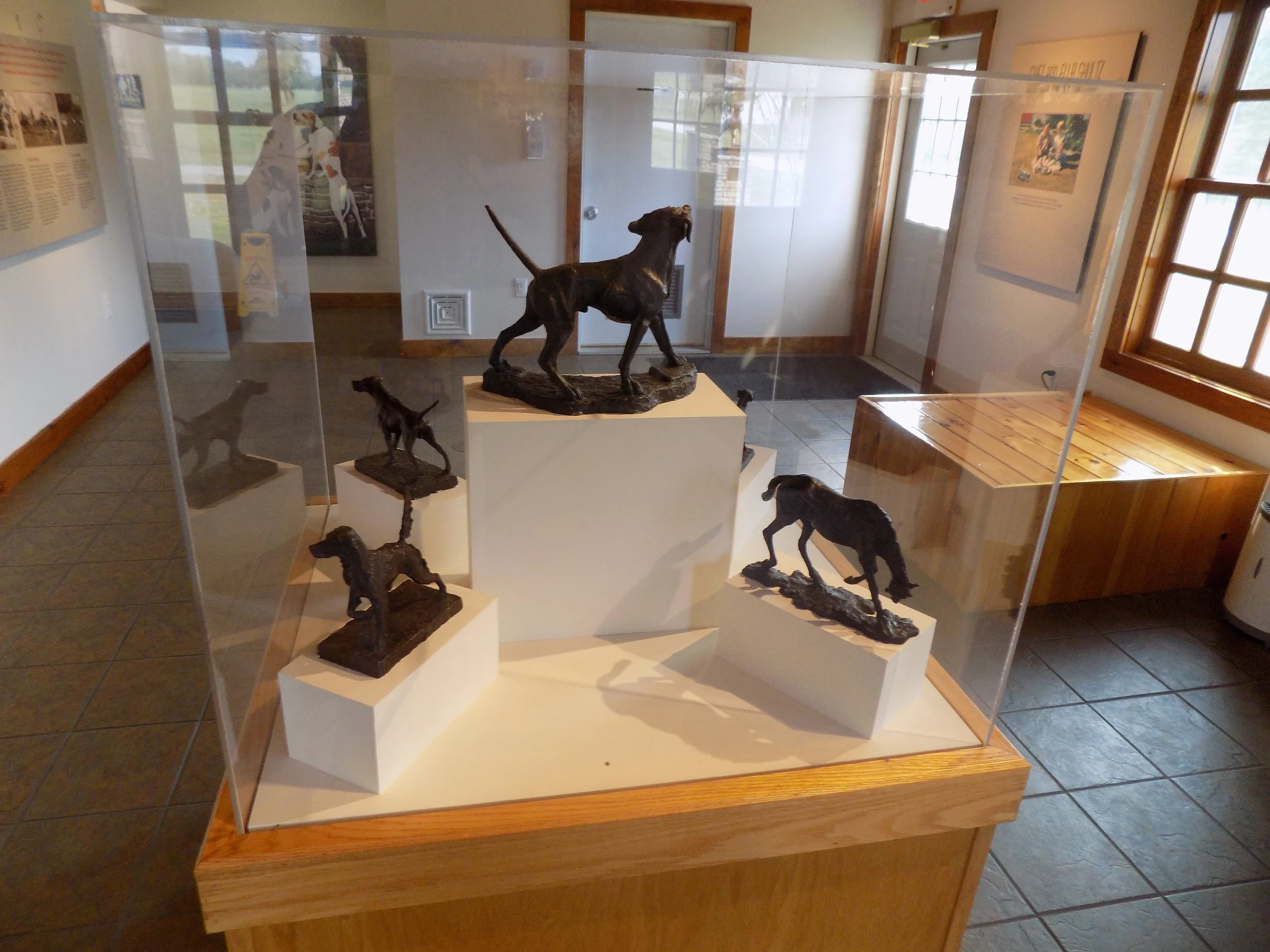 Dogs -Sculptures in case at Robert G. Wehle Dog Park, NY