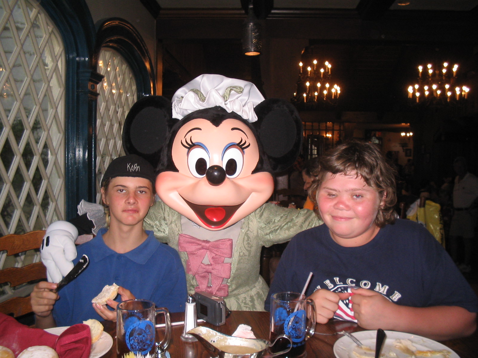 "Who is touching my shoulder?" My nephew and son when they were teens, with Minnie Mouse - Author's collection
