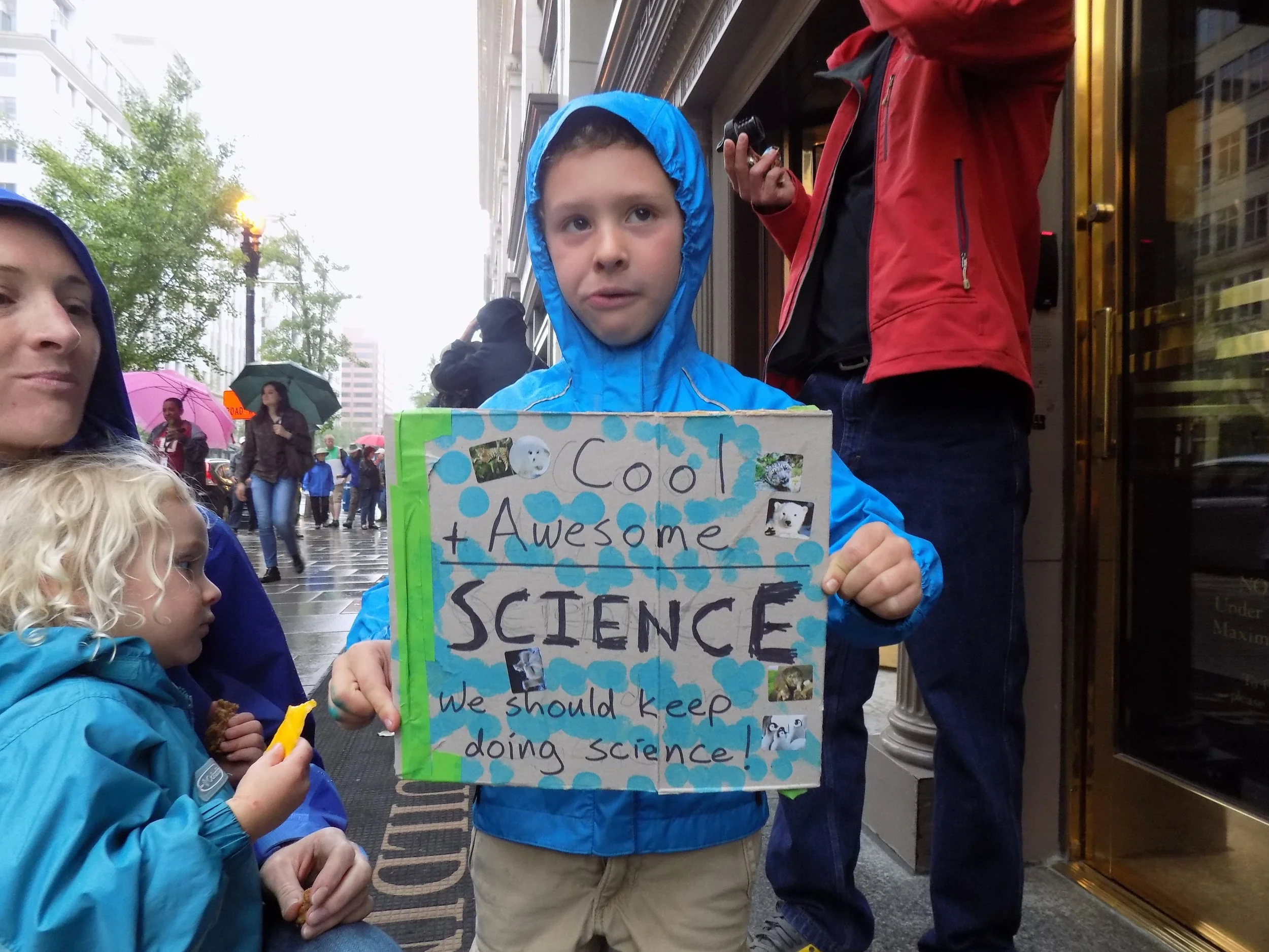 cute kid with sign.JPG