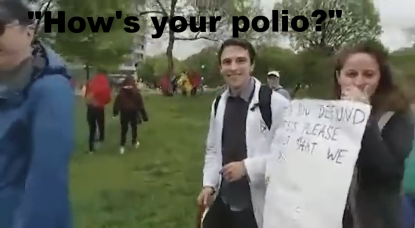 Marcher asks Coleman how his polio is. - still from PANdemic of Lies at the March for Science