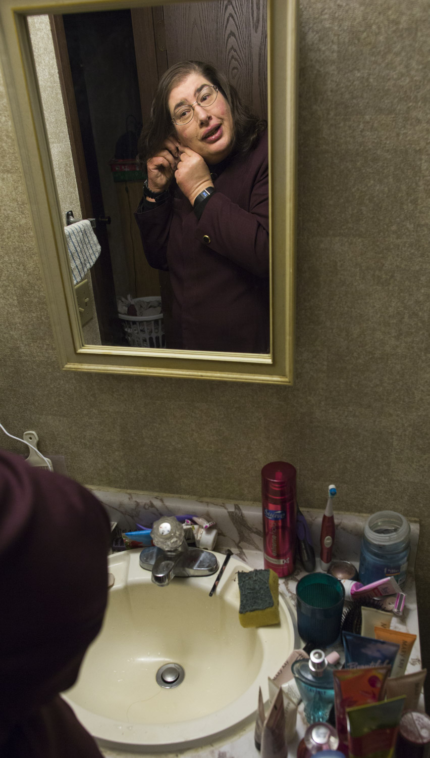 Christi gets ready before Easter Sunday Worship. Christi only started wearing earrings again 2 or 3 earlier.
