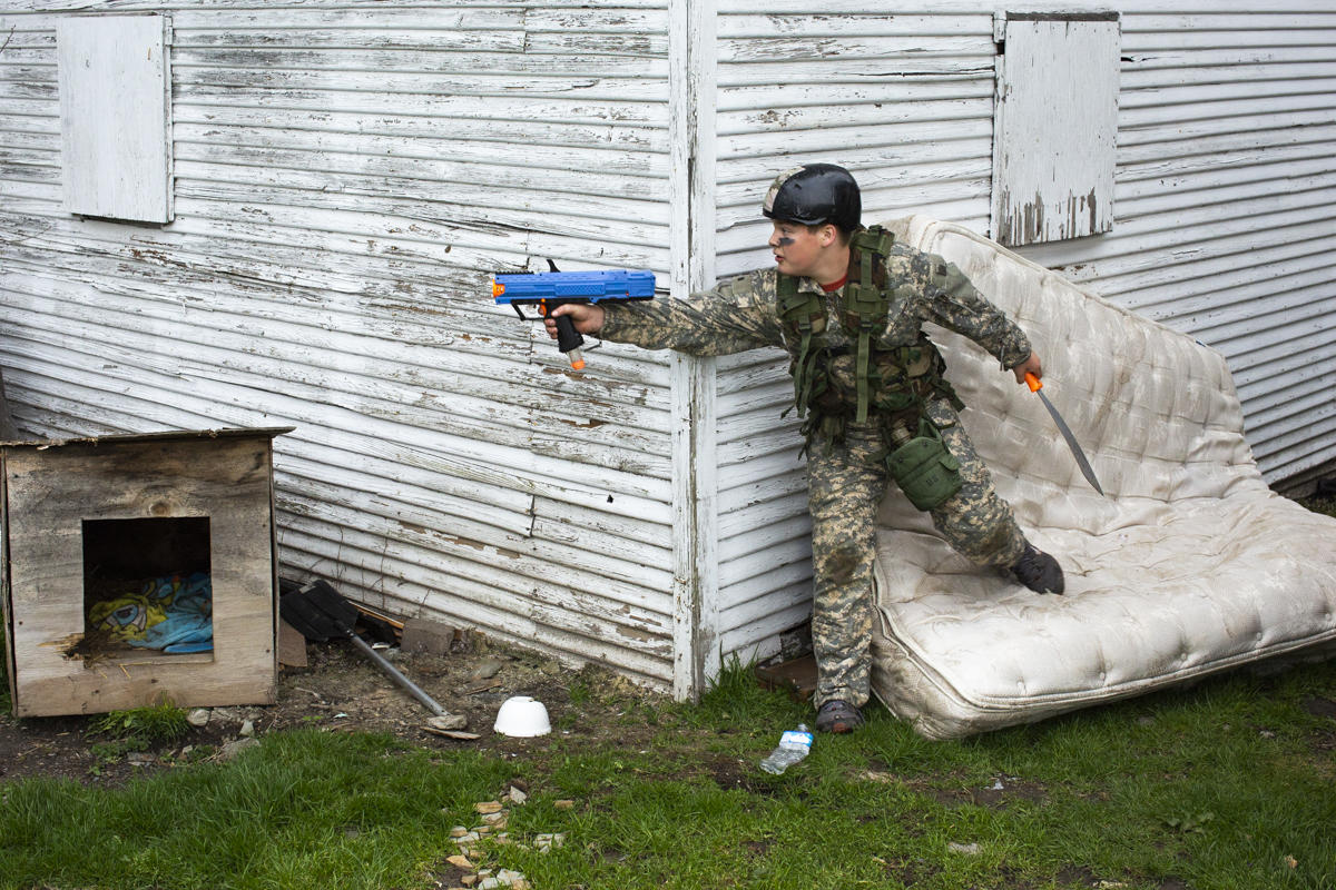 Dallas Shafer, 12, plays “army versus gangster” with his brother and a neighborhood friend. Shafer says that he gets his military gear from “a friend who has a bunch”. His favorite piece of equipment is the canteen. He says that when he grows up he wants to join the military “just because.”