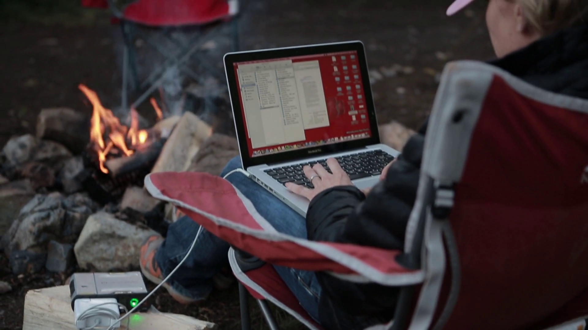 woman-on-laptop-computer-while-camping-fire_hlpispnoe_thumbnail-full06.png