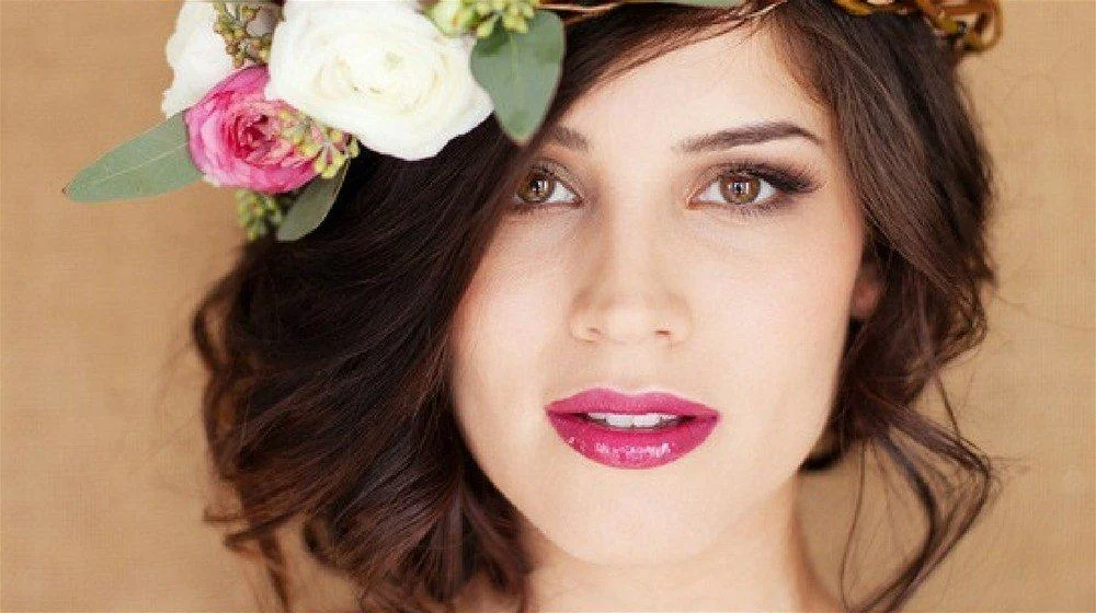 Berry Stained Lips: If you’ve got a berry-themed wedding, I highly suggest following suit and wearing a matching hue on your lips. To help balance the loud color of your lipstick, keep the rest of your makeup neutral by only using shades of beige, tan, and taupe.