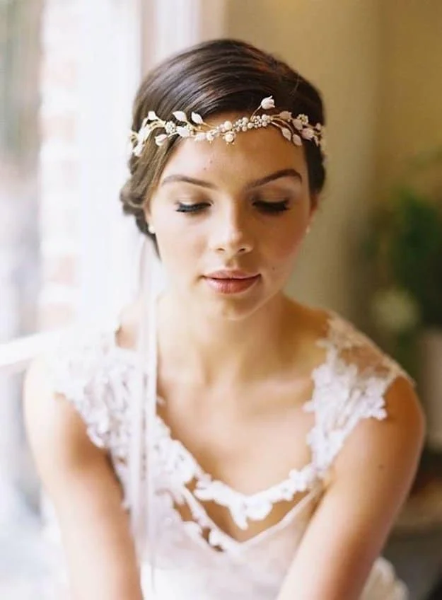 Greek Goddess: Channel your inner Aphrodite by pairing your headpiece with falsies, a flawless face, and a coral-tinted lip. Keep your brows natural looking by using a light hand when applying a shade that’s close to your brow color.
