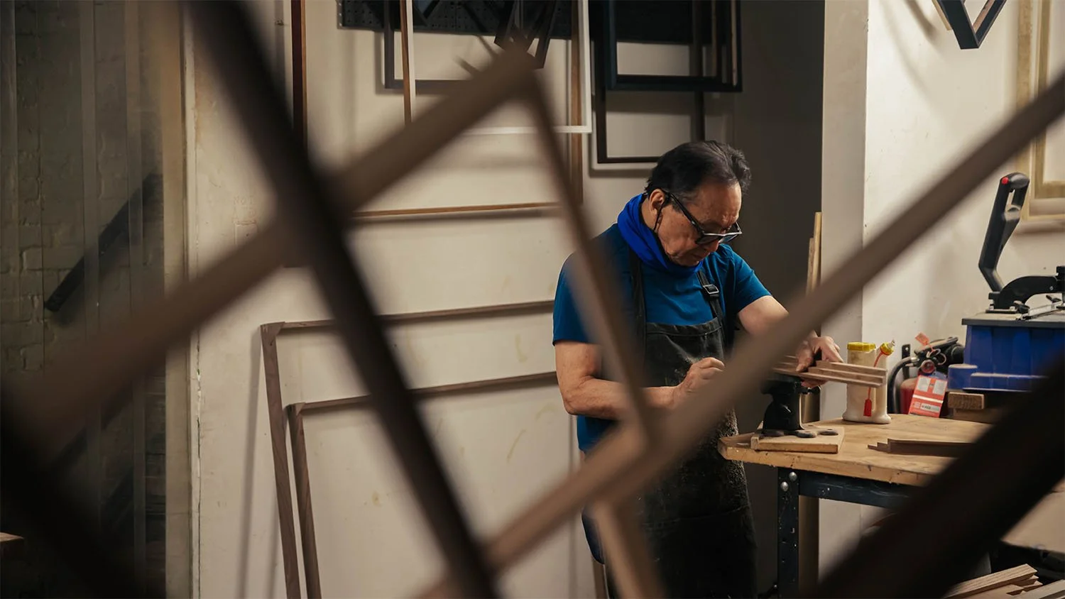 The shop master with his frames.