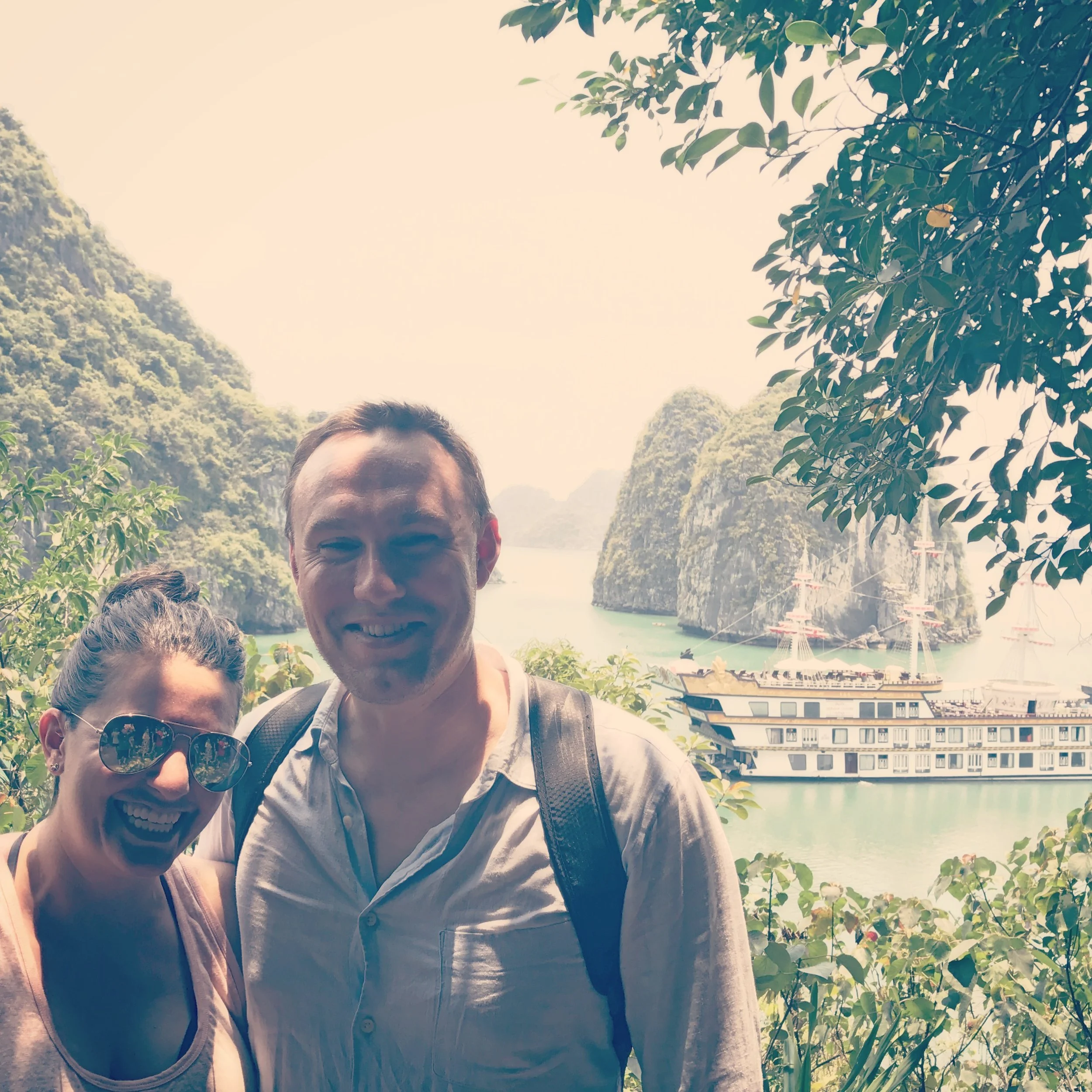 Nicole and I in Halong Bay -- our tour boat, the "Dragon Legend" in the background