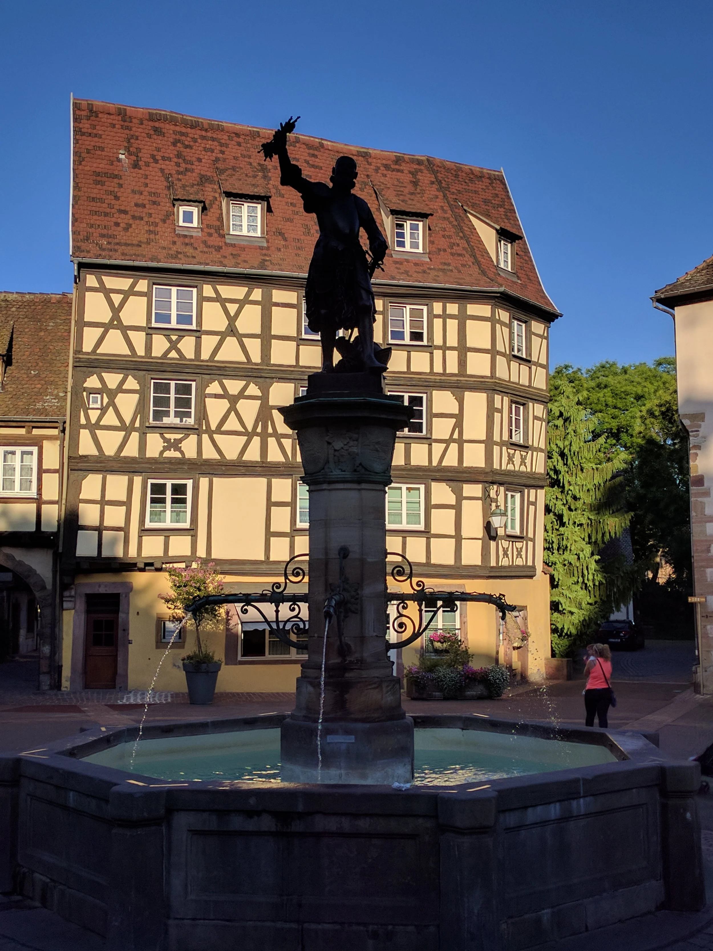 A statute across from the wine hall in Colmar depicting a victorious noble returning from battle in Hungary with Tokay grapes that were subsequently introduced to Alsace (and renamed Pinot Gris); The statue was designed by Frederic Bartholdi -- designer of the Statue of Liberty and native of Colmar