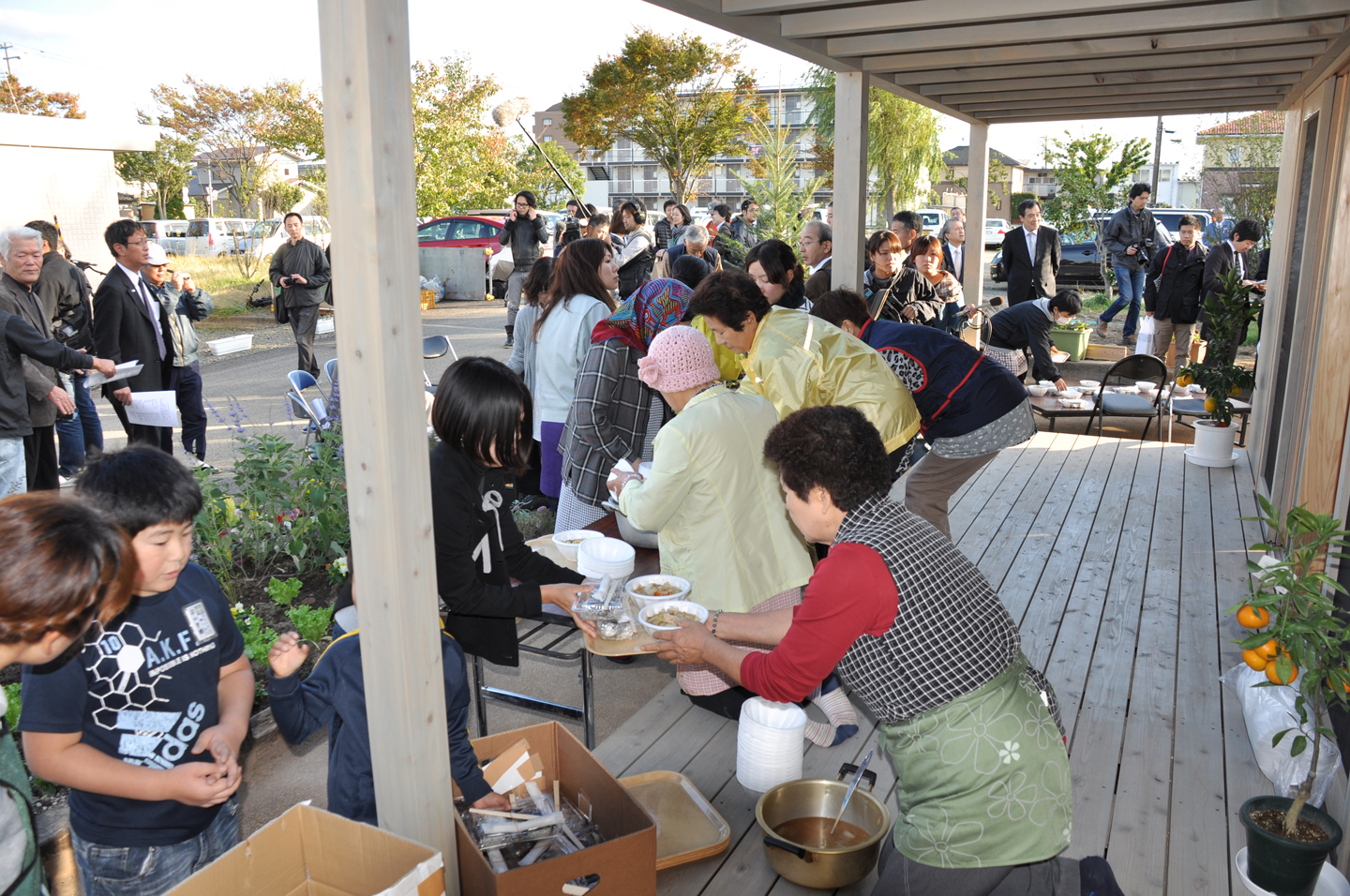 Sendai_3_People-living-in-the-temporary-house-served--traditionl-soup-after-the-ceremony.jpg