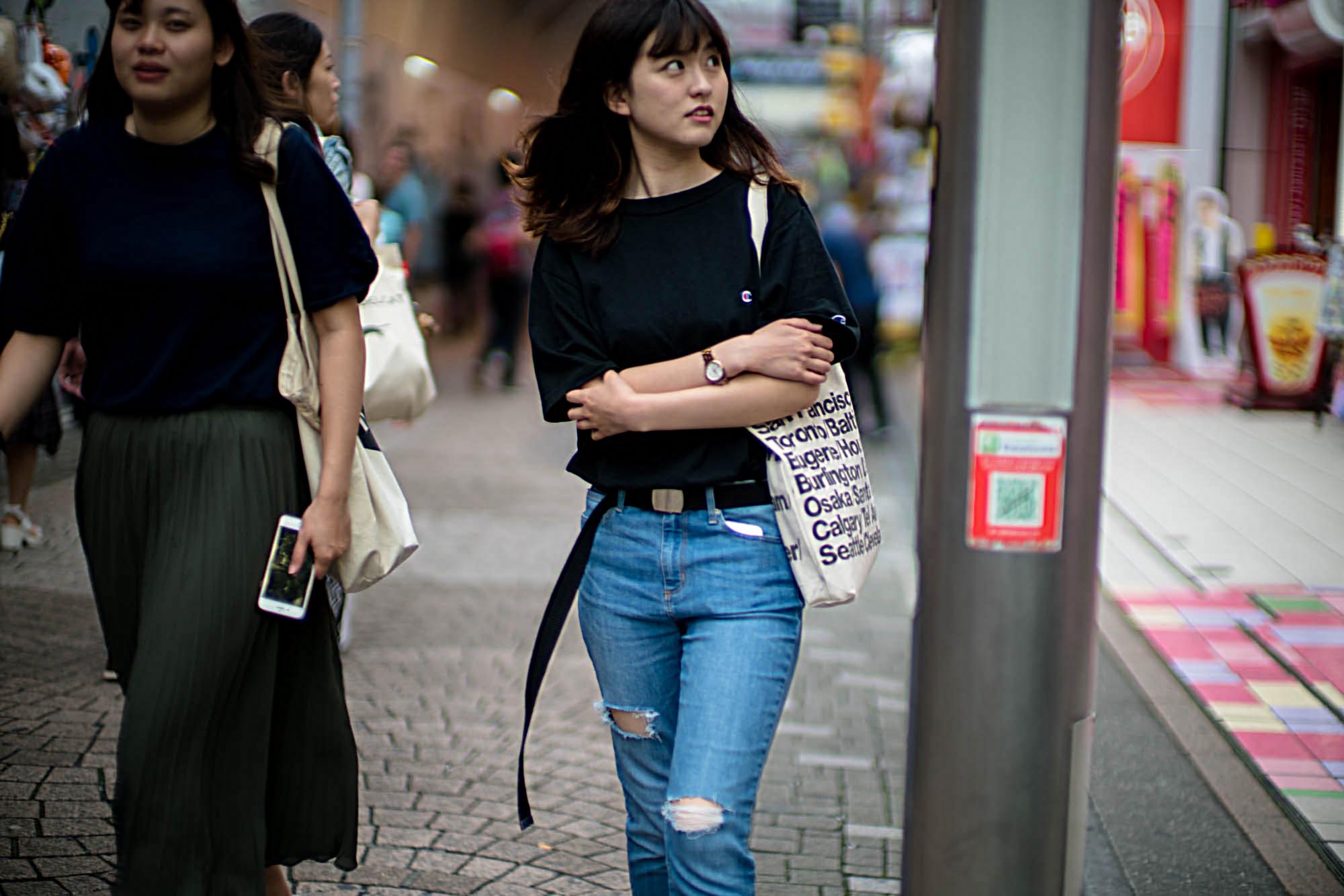 The difficulty of getting focus wide open at f/0.95 in street photography can be seen in this image. Even though you can focus peak, the focus peaking isn't completely exact in confirming focus on the lead eye. To be fair, the focus peaking is a good focusing guide, but it's not enough to get tack focus if the subject's face is not close enough for the photographer to better visually evaluate the subject for better focus.