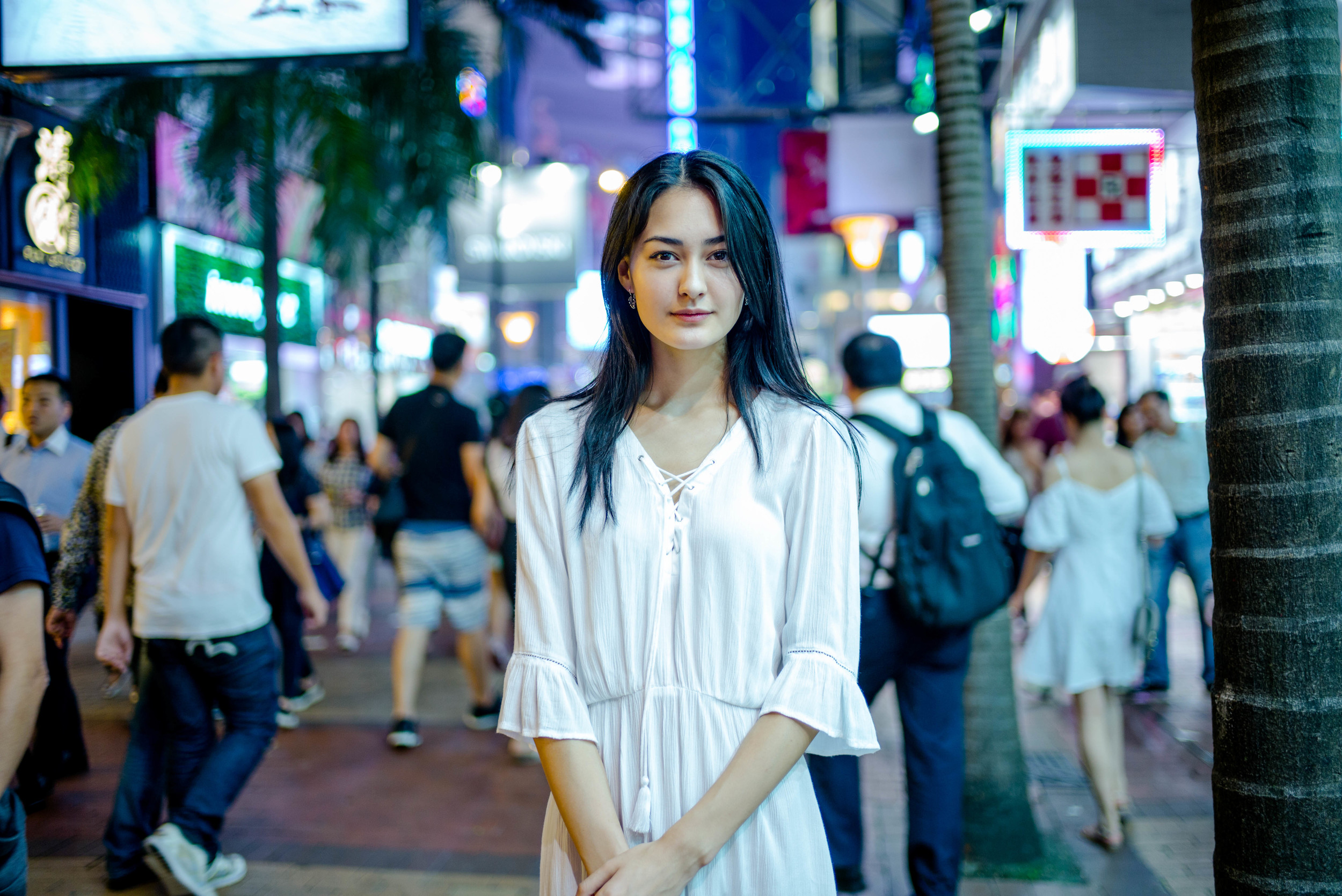 35mm f/1.4 Summilux FLE - This is an example of a very ideal night shot. The subject is well lit, and the background is full of action and light all blurred out by the shallow depth of field. You get both context and isolation of the subject. This would not be as effective on a lens with a larger maximum aperture.