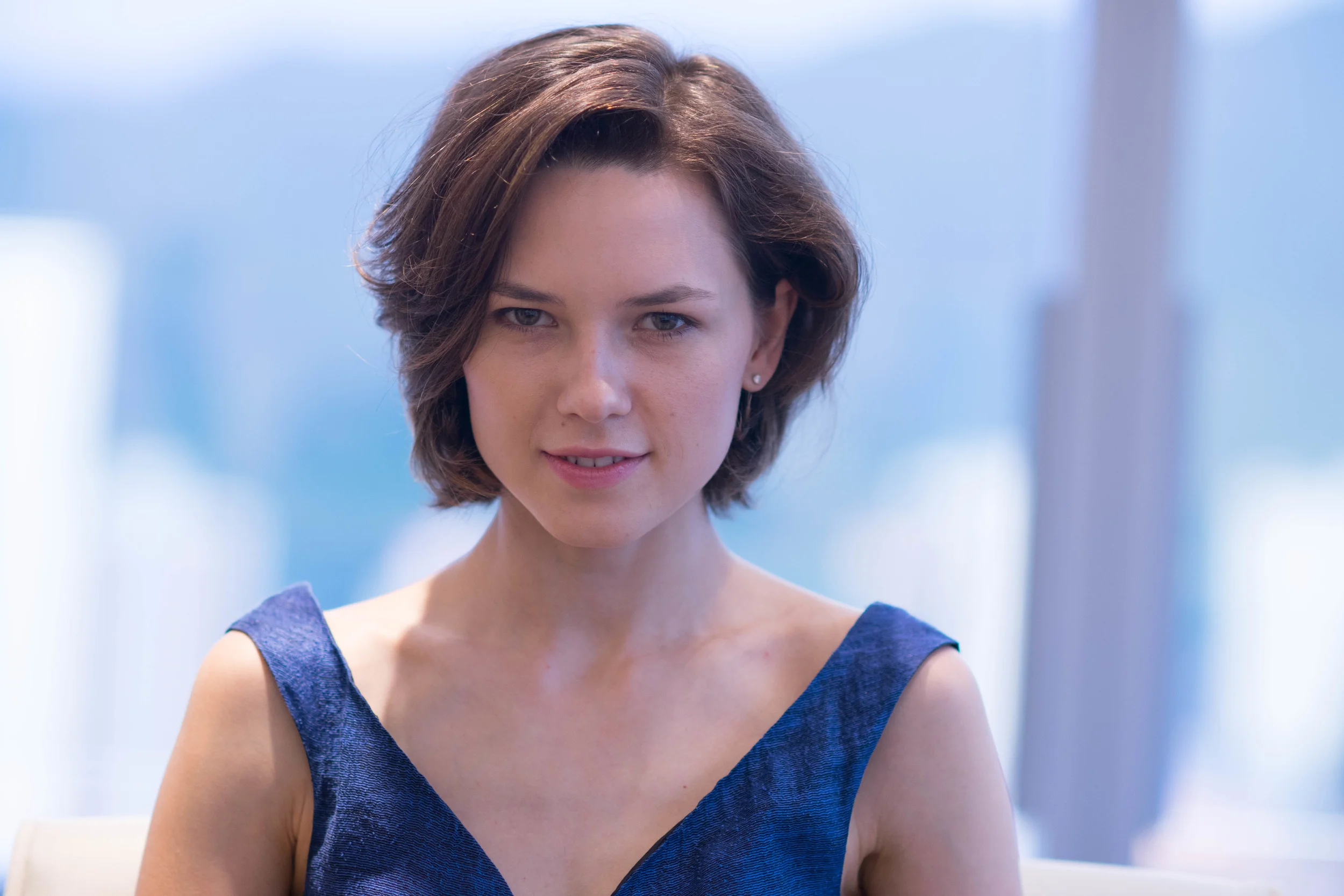 Nikon 135mm f/2.0 DC. At 135mm, the background appears to be getting more blurred out than the Noctilux. But this is largely a factor of blowing up the background, which in turn reduces the background area for the lens to render bokeh.