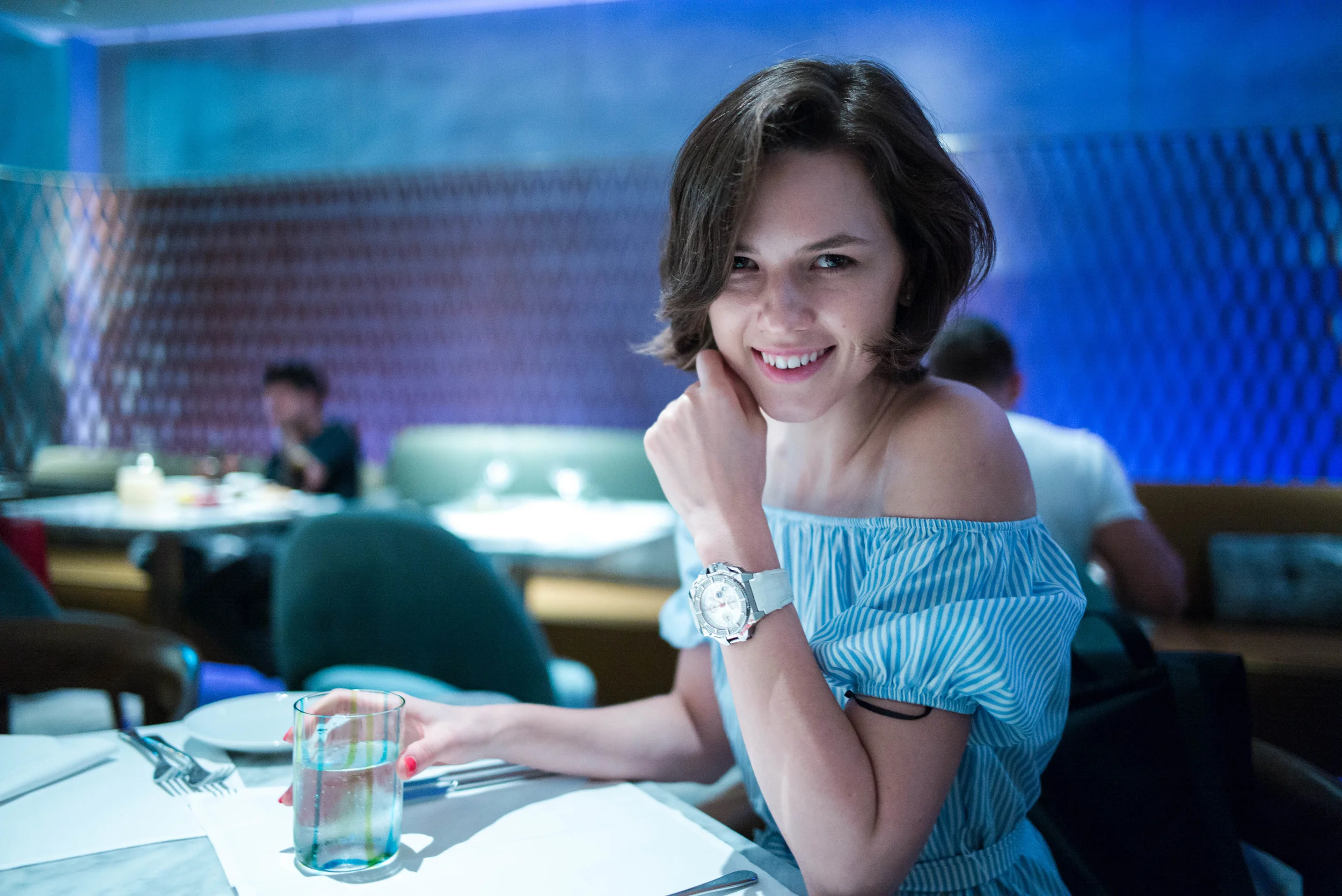 Because I was shooting relatively closer on this shot, and because the lighting was creating a combination of unpleasant highlights and shadow on the subjects face, made worse by some distortion, I asked her to tilt her head down, for a more pleasing look.