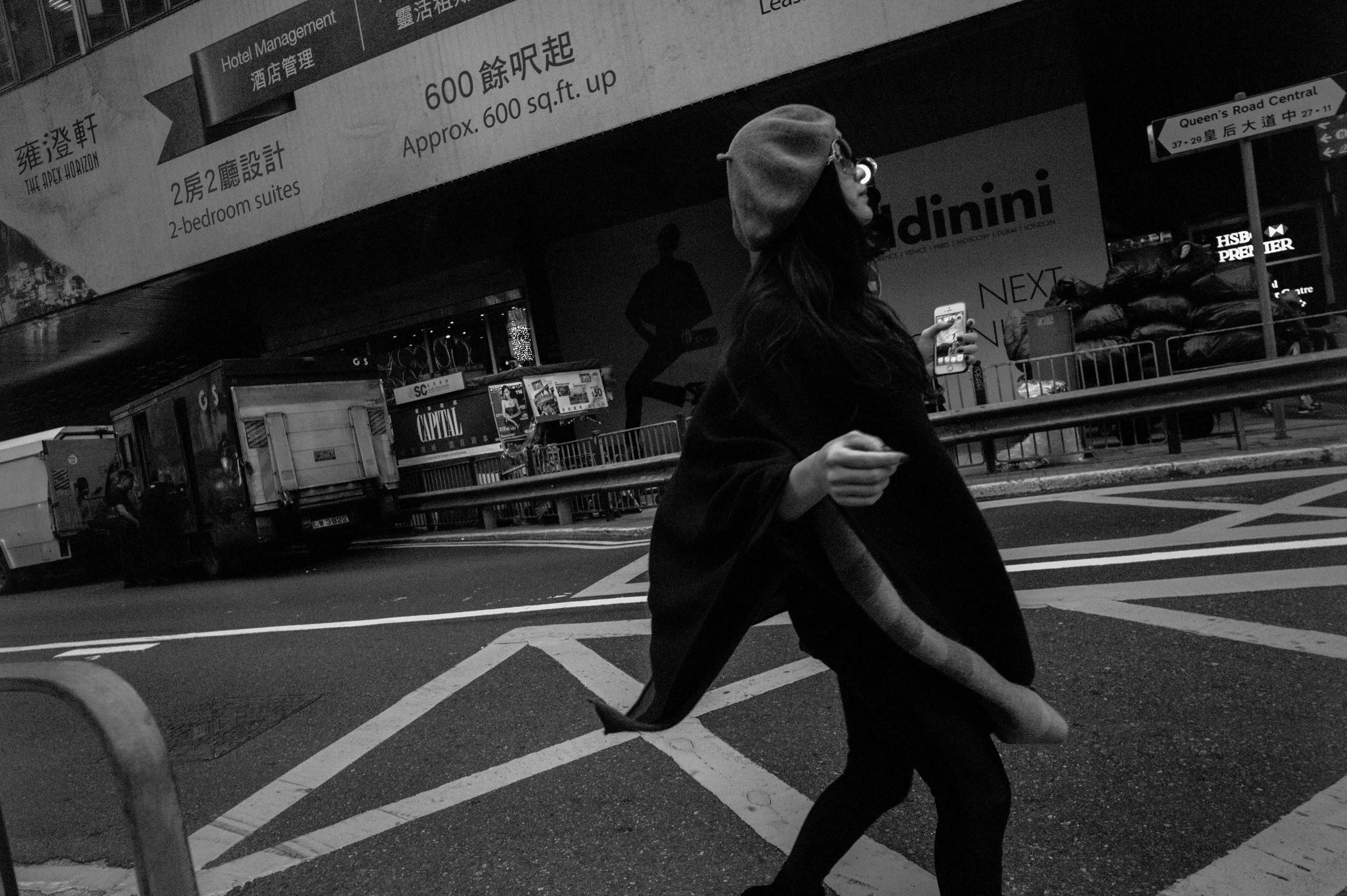 This image is significantly underexposed. The details in the subject's clothes has essentially all been crushed. Stylistically, the subject appears more a silhouette than three dimensional. However, the reduction in details render the image more dramatic, reinforced further by the tilted wide angle perspective. Leica M Monochrome + 21mm f/3.4 Super Elmar ASPH.