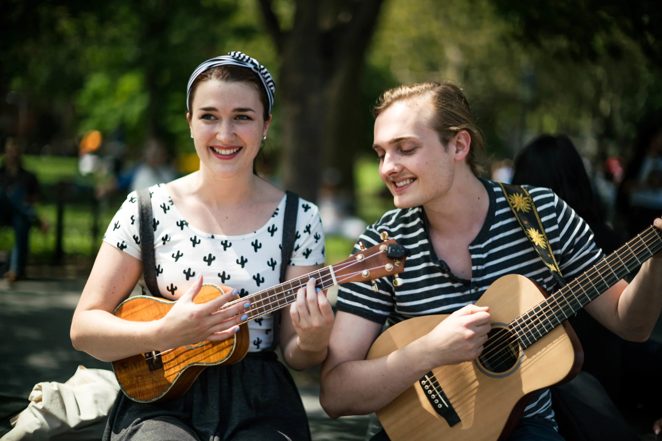 All day I've been trying to hit focus wide open at f/1.2. Unfortunately, with this lens, it's impossible to purposely get focus wide open without help from the subject staying perfectly still. In the end, I just gave up, and decided to photograph the subject in this image - two very talented musicians at Washington Square Park. Even so, they were singing and strumming along, so they weren't exactly still for the wide open shot. Shot wide open at f/1.2.