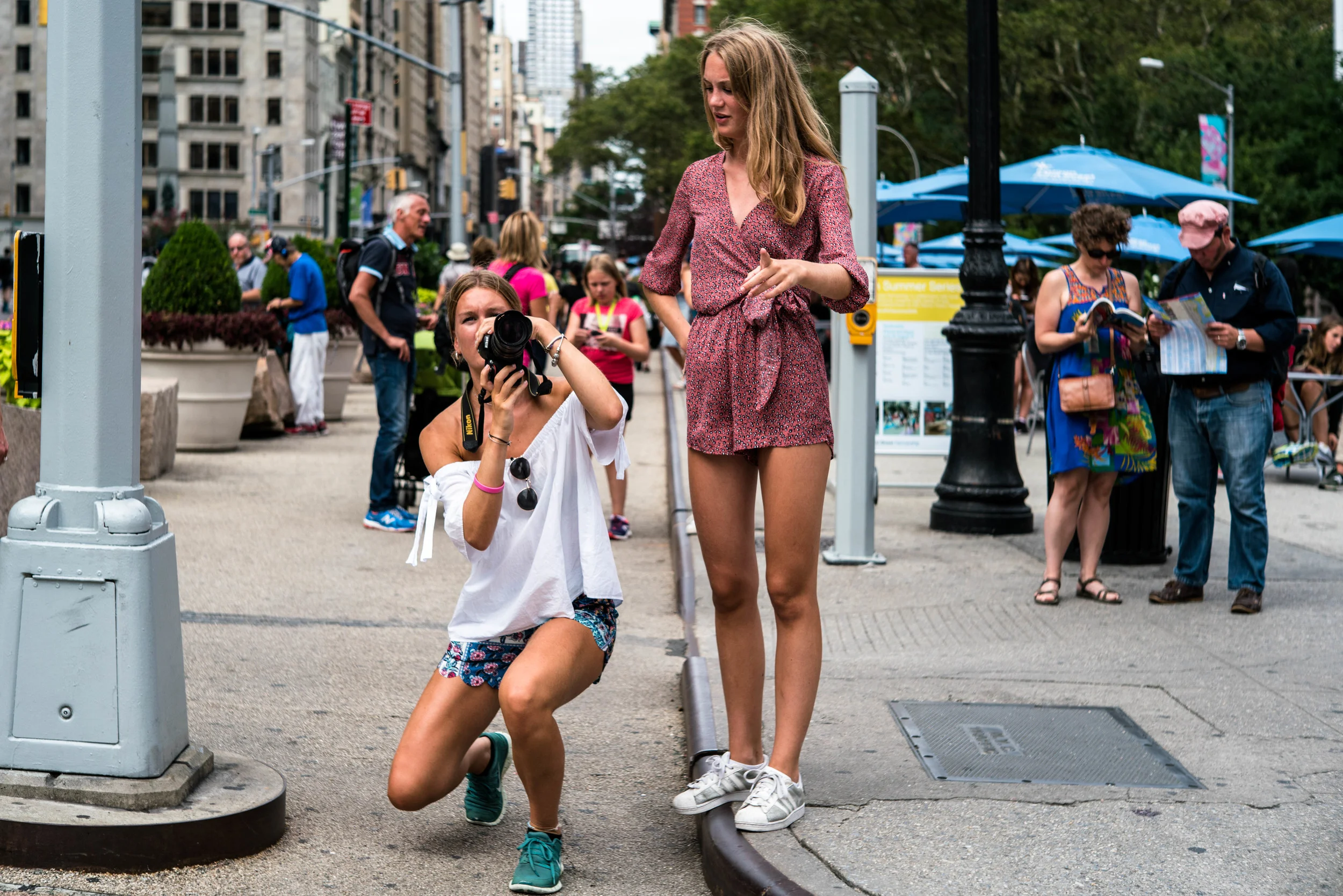 I shot this image because it was just the cutest thing to see - visitors taking picture of the Flat Iron Building, on a cropped sensor Nikon. Love the photography theme in the image.