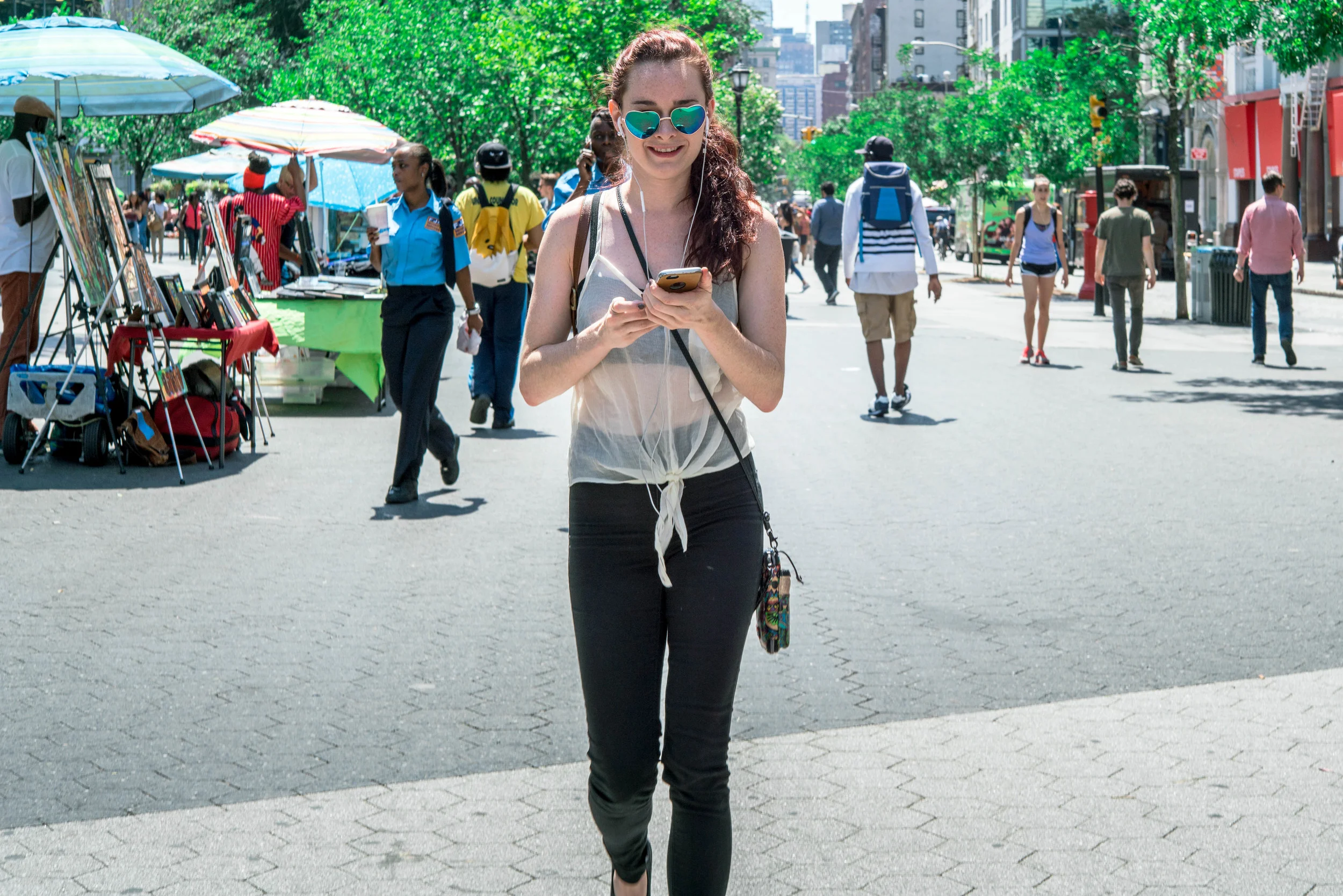 People really look at their phones way too much. But in the case of this subject, I suppose she's looking up? But that's because I'm directly in front of her, and she doesn't want to bump into me.