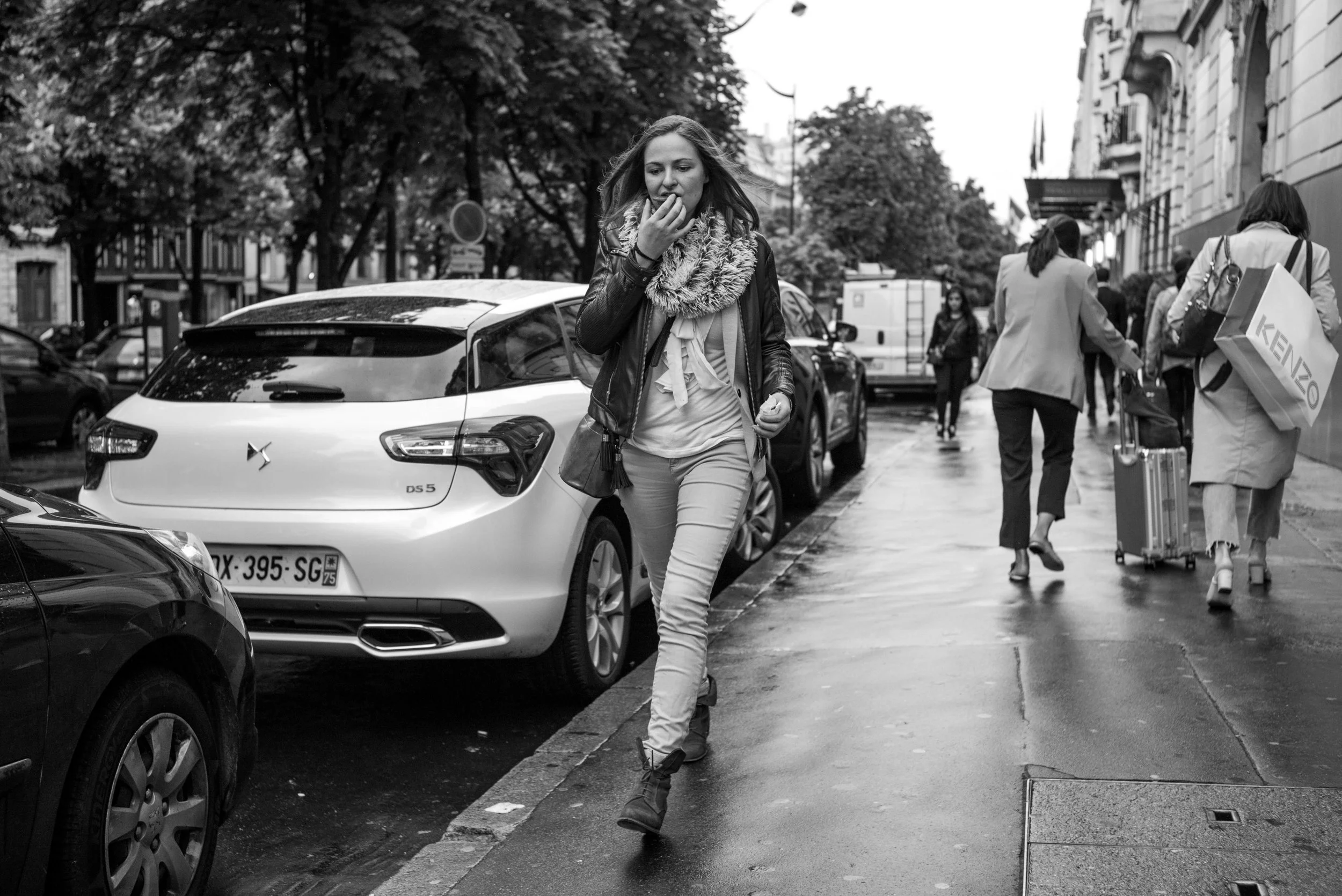 The subject is in the process of eating something. How is this a good image? At the very best, it's just another example of street documentation. If I actually took the time to observe her, I probably wouldn't have taken the shot.