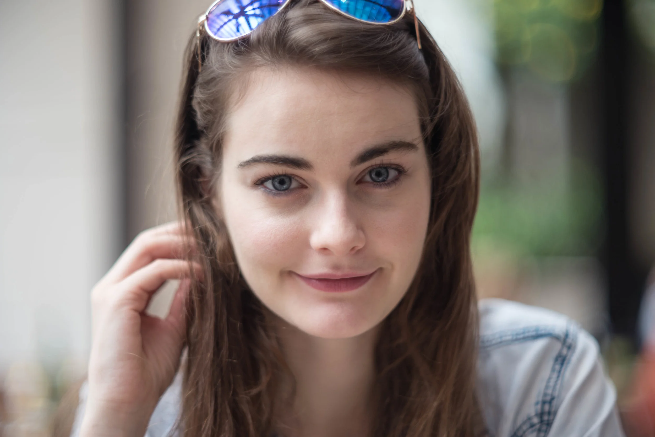 Seated for lunch at a table. At 85mm, you're not going to get an environmental documentation in the background and foreground - which means, no food in the image. But already, you can see that the bokeh has a character of it's own.