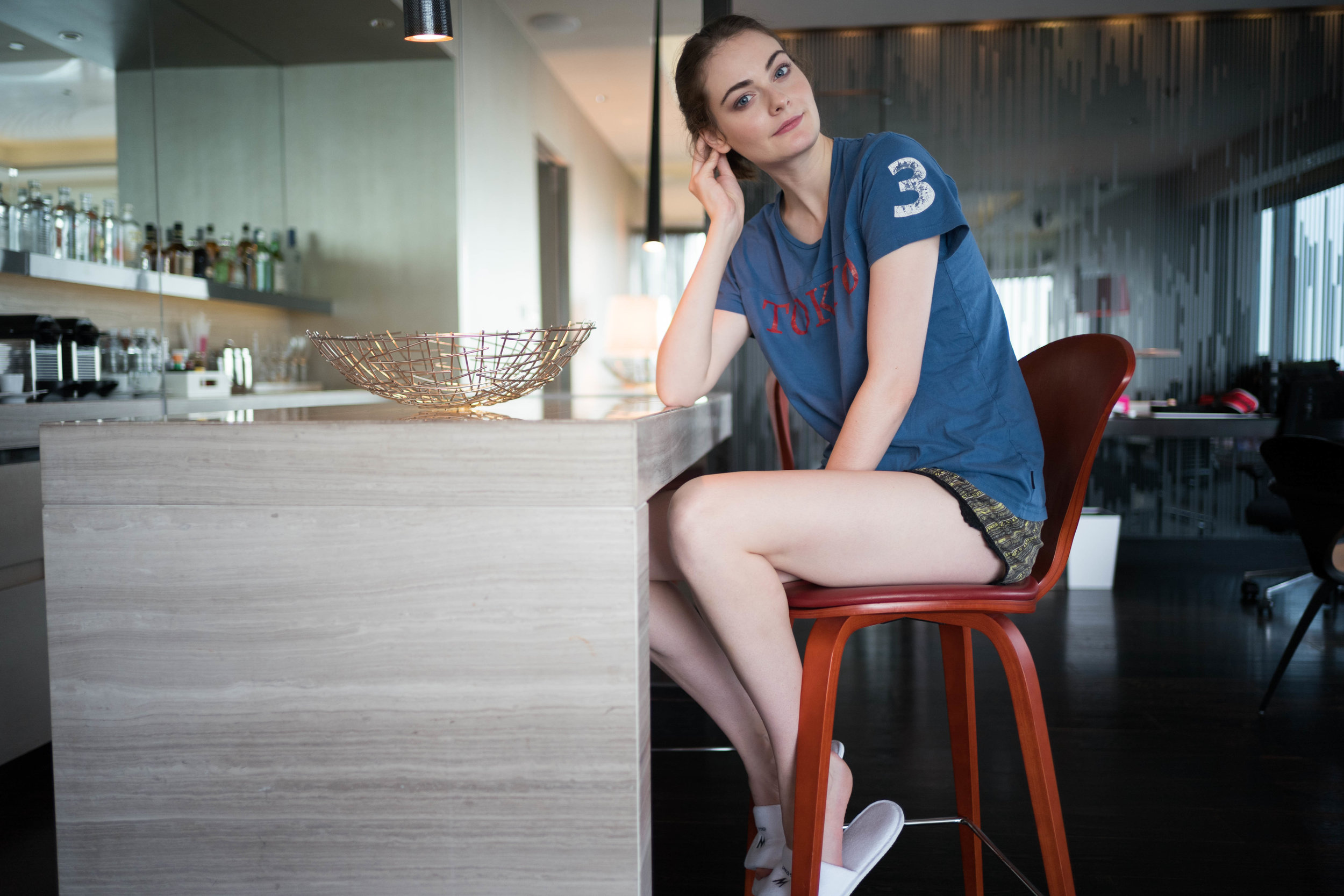 With our interaction becoming more casual, a bond of trust has developed. On the bar stool. Leica 28mm f/1.4 Summilux