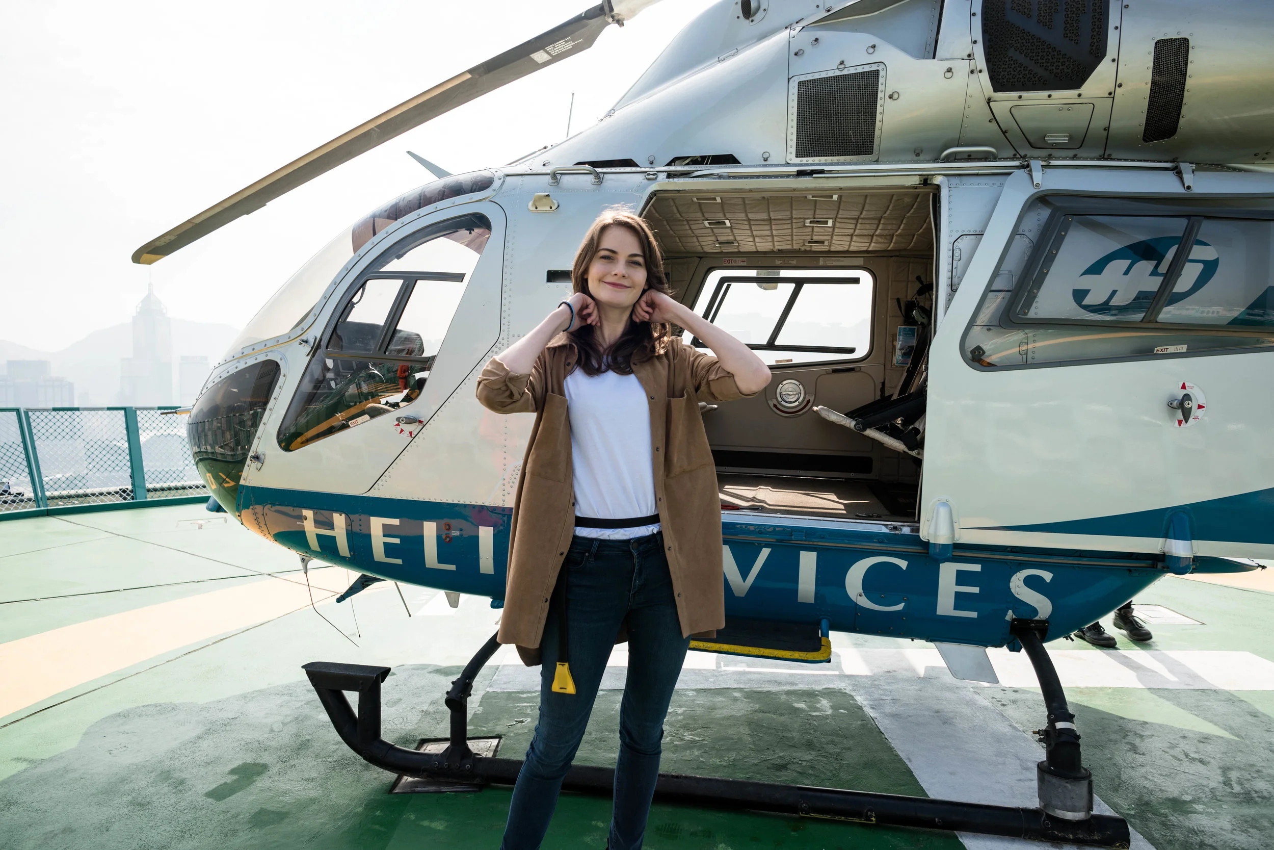 Boarding the helicopter. Anna already has the life preserver strapped around her waist. It is an aviation regulation requirements.